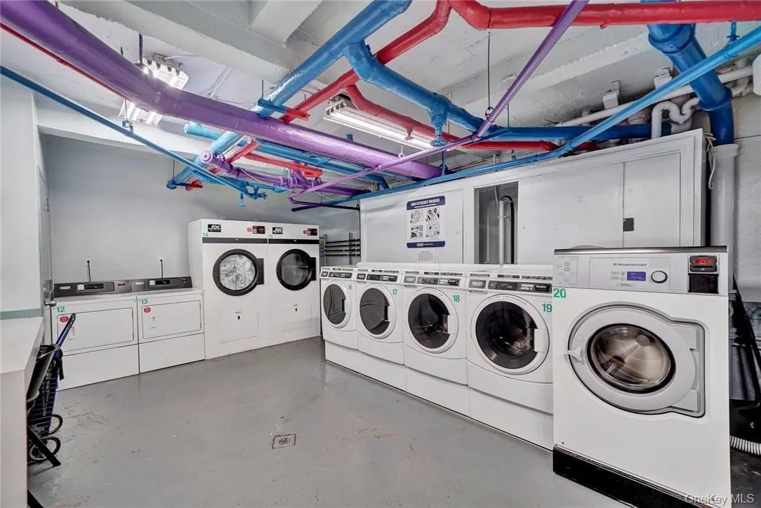 Clothes washing area featuring independent washer and dryer Clothes washing area featuring independent washer and dryer