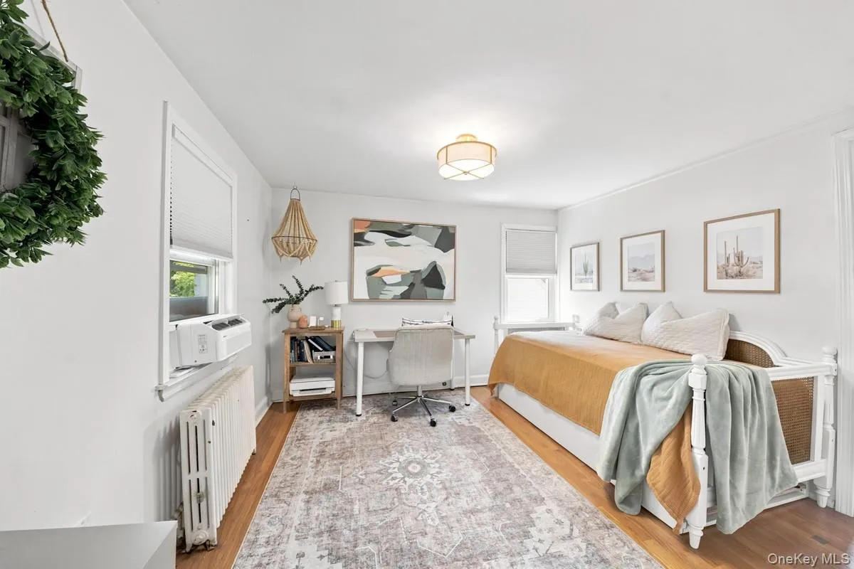 Second Bedroom. Hardwood flooring and contemporary light fixture. Second Bedroom. Hardwood flooring and contemporary light fixture.