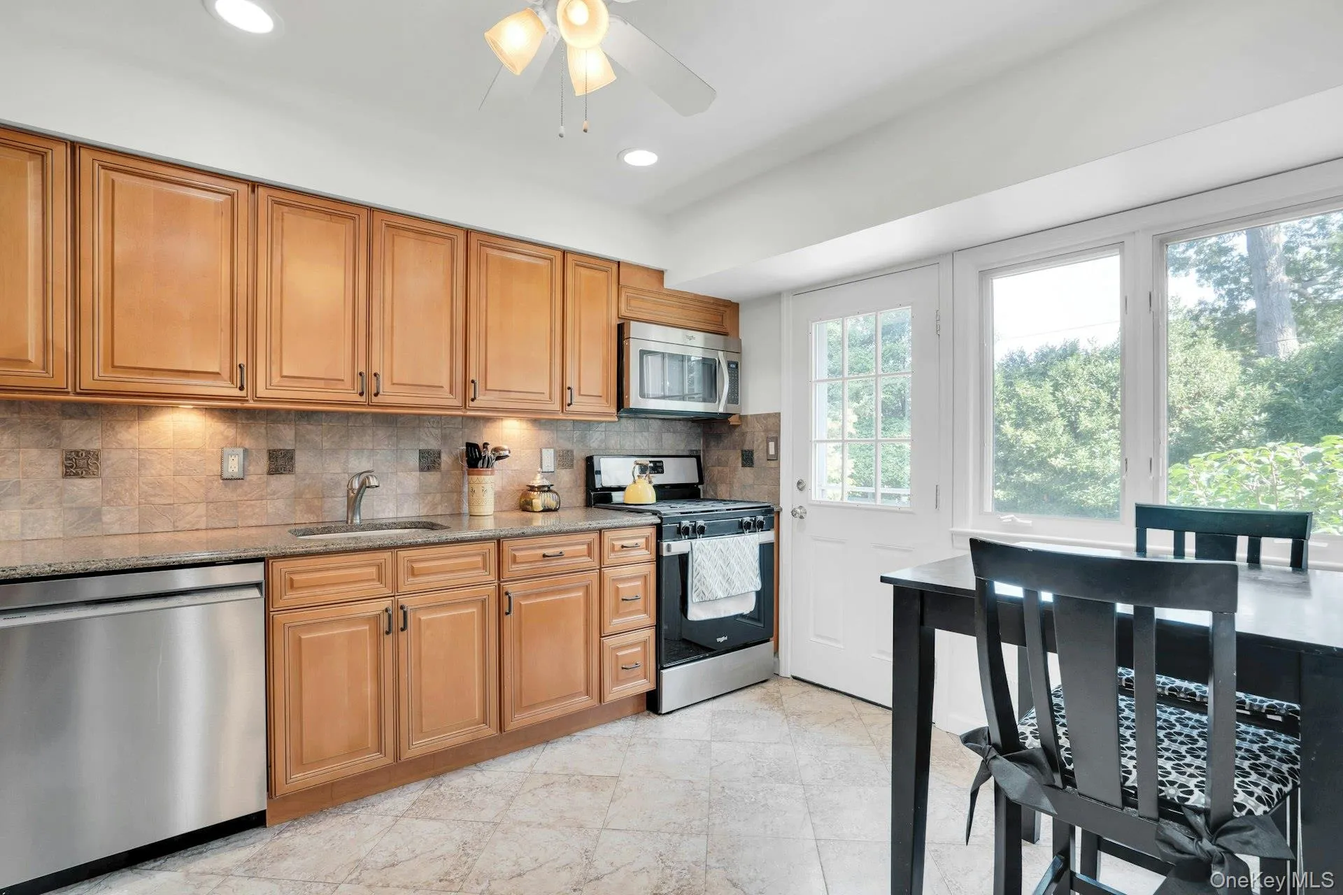 Updated kitchen with custom wood cabinets. Updated kitchen with custom wood cabinets.