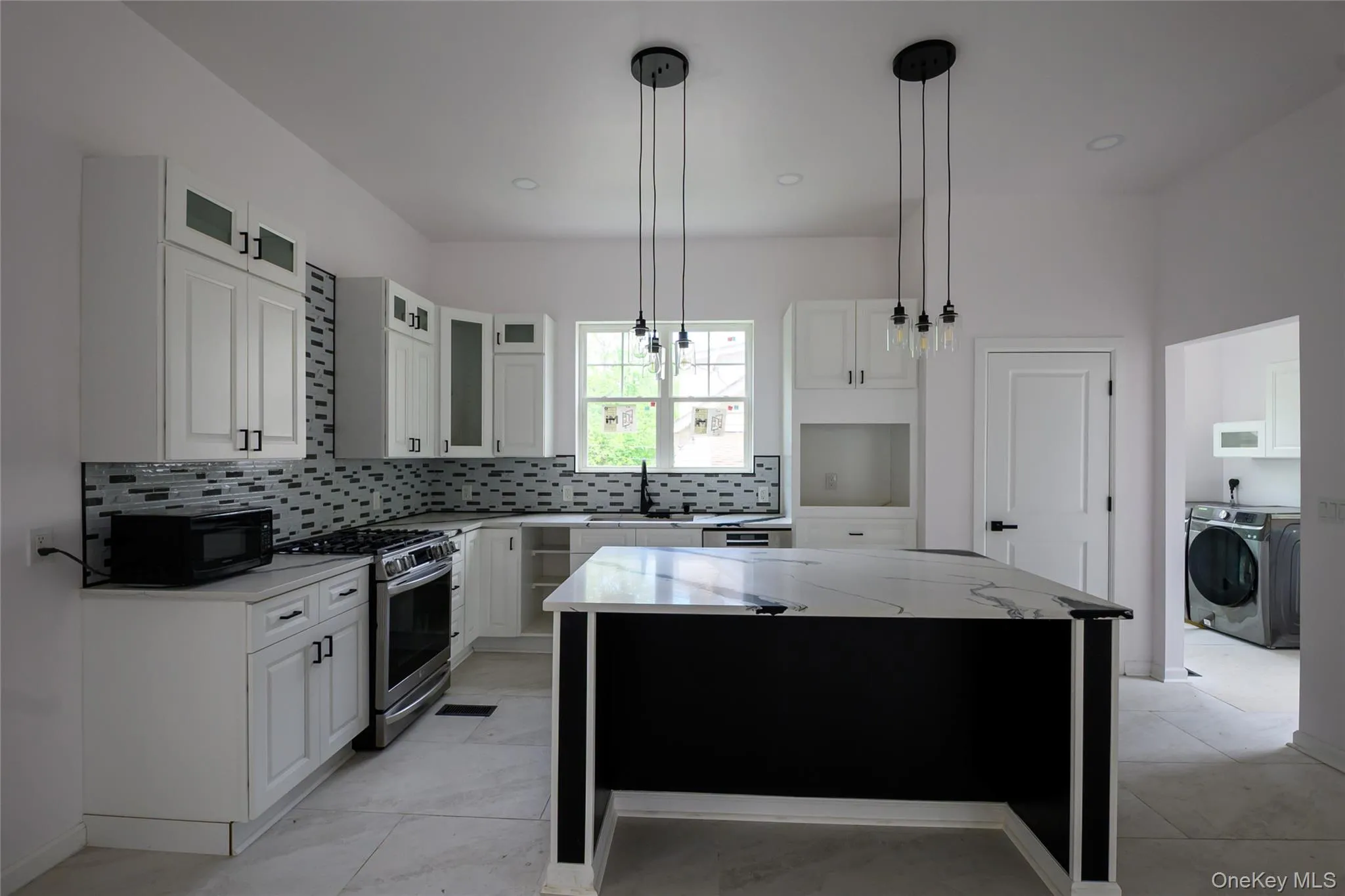Kitchen view with laundry room Kitchen view with laundry room