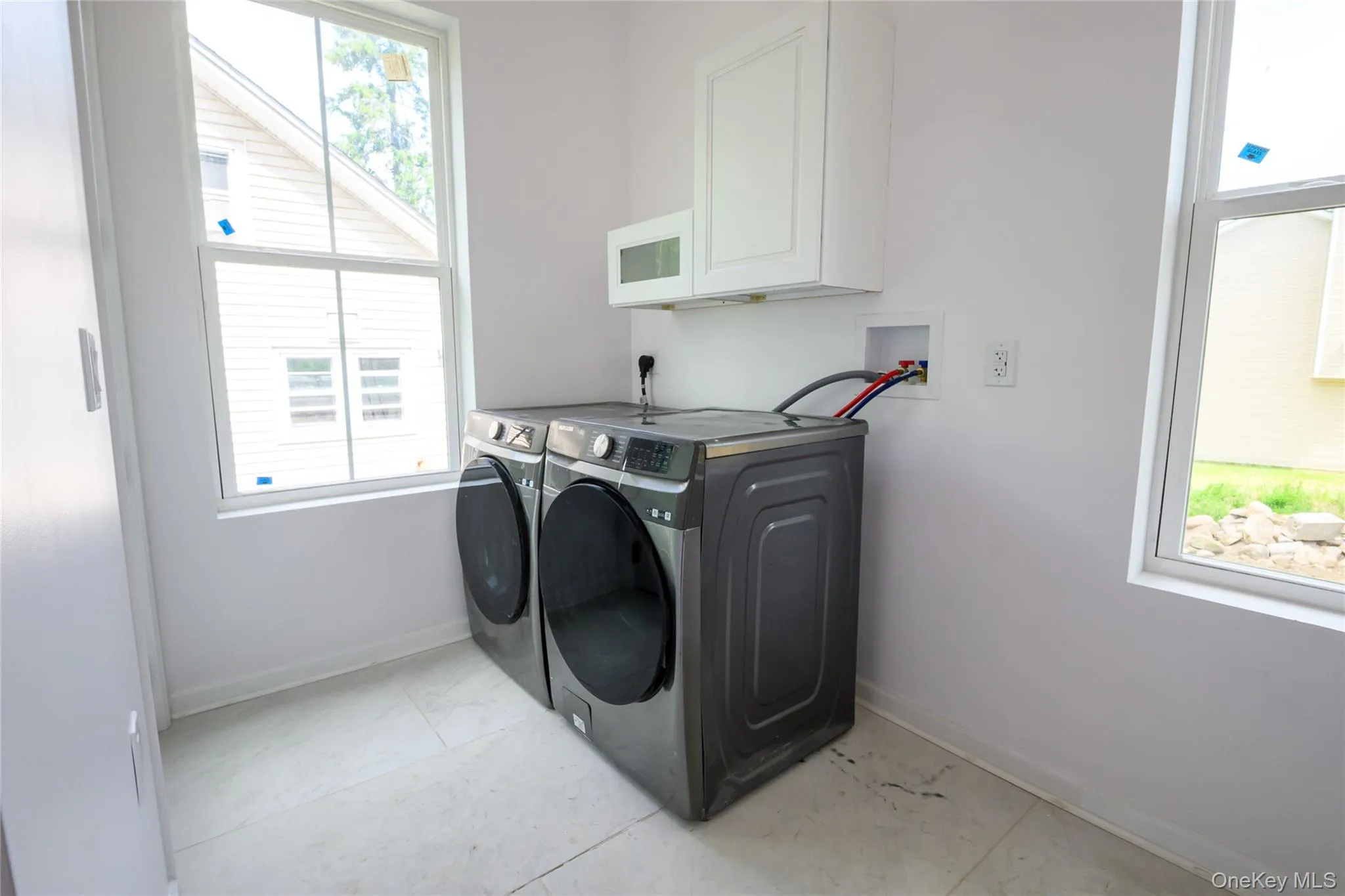Laundry / Mud Room off the kitchen with door to the back of the house Laundry / Mud Room off the kitchen with door to the back of the house