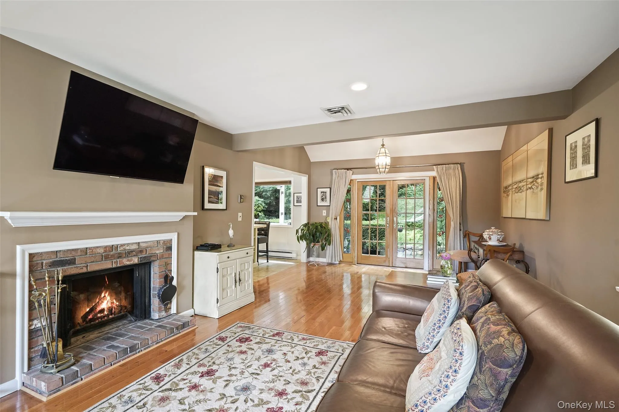 Great room includes living room with wood burning fireplace and dining area Great room includes living room with wood burning fireplace and dining area