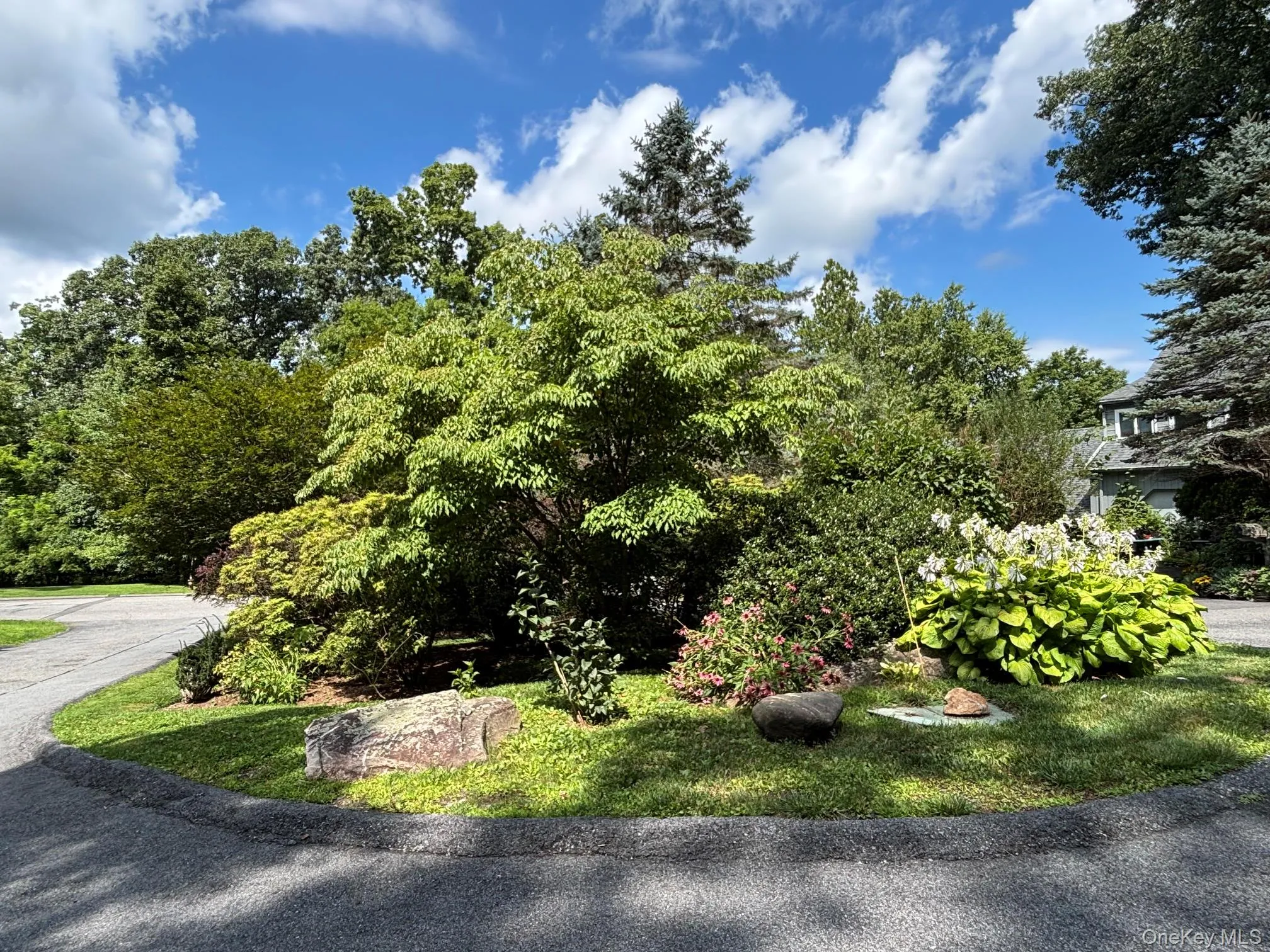 Welcome to Peach Court. Center island with mature plantings offers privacy. Welcome to Peach Court. Center island with mature plantings offers privacy.