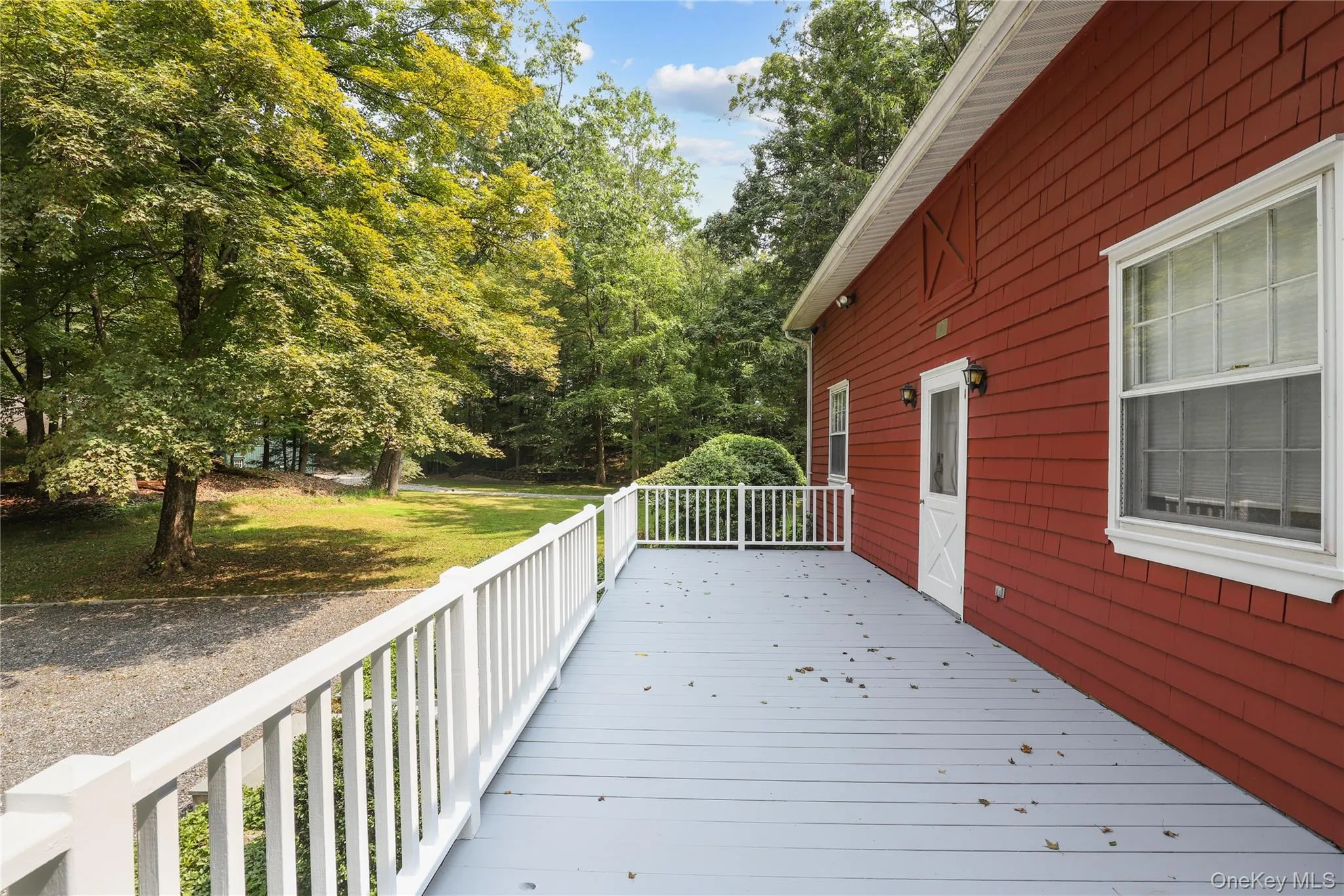 Lovely deck along the front of the house. Lovely deck along the front of the house.