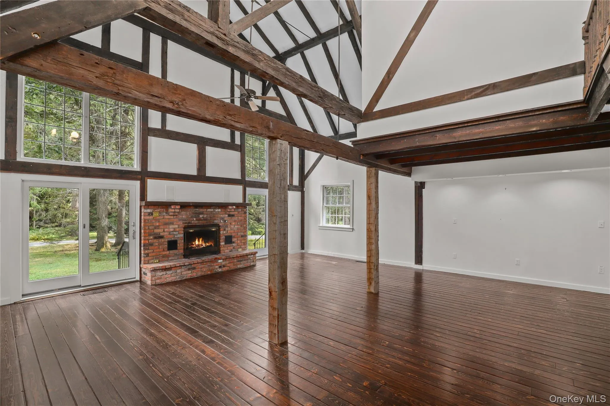Another view of the living room and fireplace. Another view of the living room and fireplace.