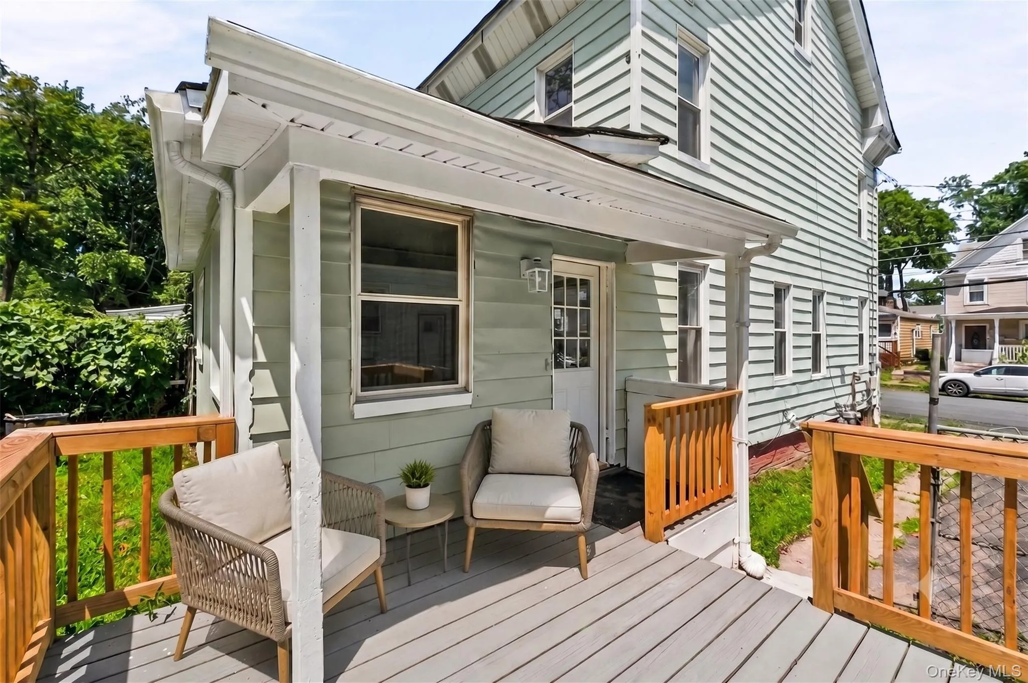 Virtually Staged. Welcomingcovered porch with room forcomfortable seating, creating acharming spot to enjoymorning coffee or unwindoutdoors. Virtually Staged. Welcomingcovered porch with room forcomfortable seating, creating acharming spot to enjoymorning coffee or unwindoutdoors.