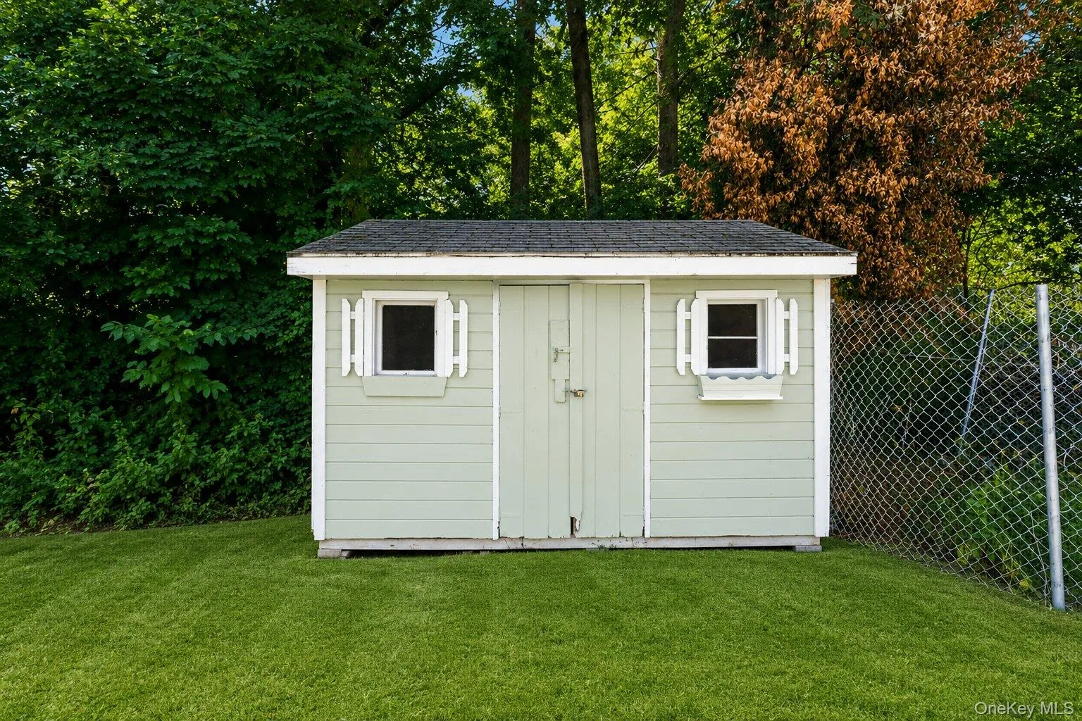 Charming detached storageshed with double-door access,ideal for tools, seasonal items,and outdoor equipment. Charming detached storageshed with double-door access,ideal for tools, seasonal items,and outdoor equipment.
