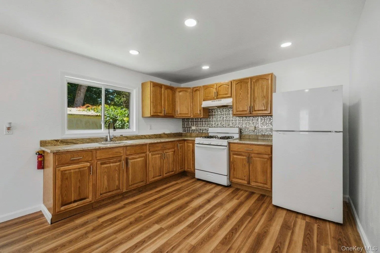 generous counter space, warmwood cabinetry, and room for adining table make this kitchenboth functional and inviting. generous counter space, warmwood cabinetry, and room for adining table make this kitchenboth functional and inviting.