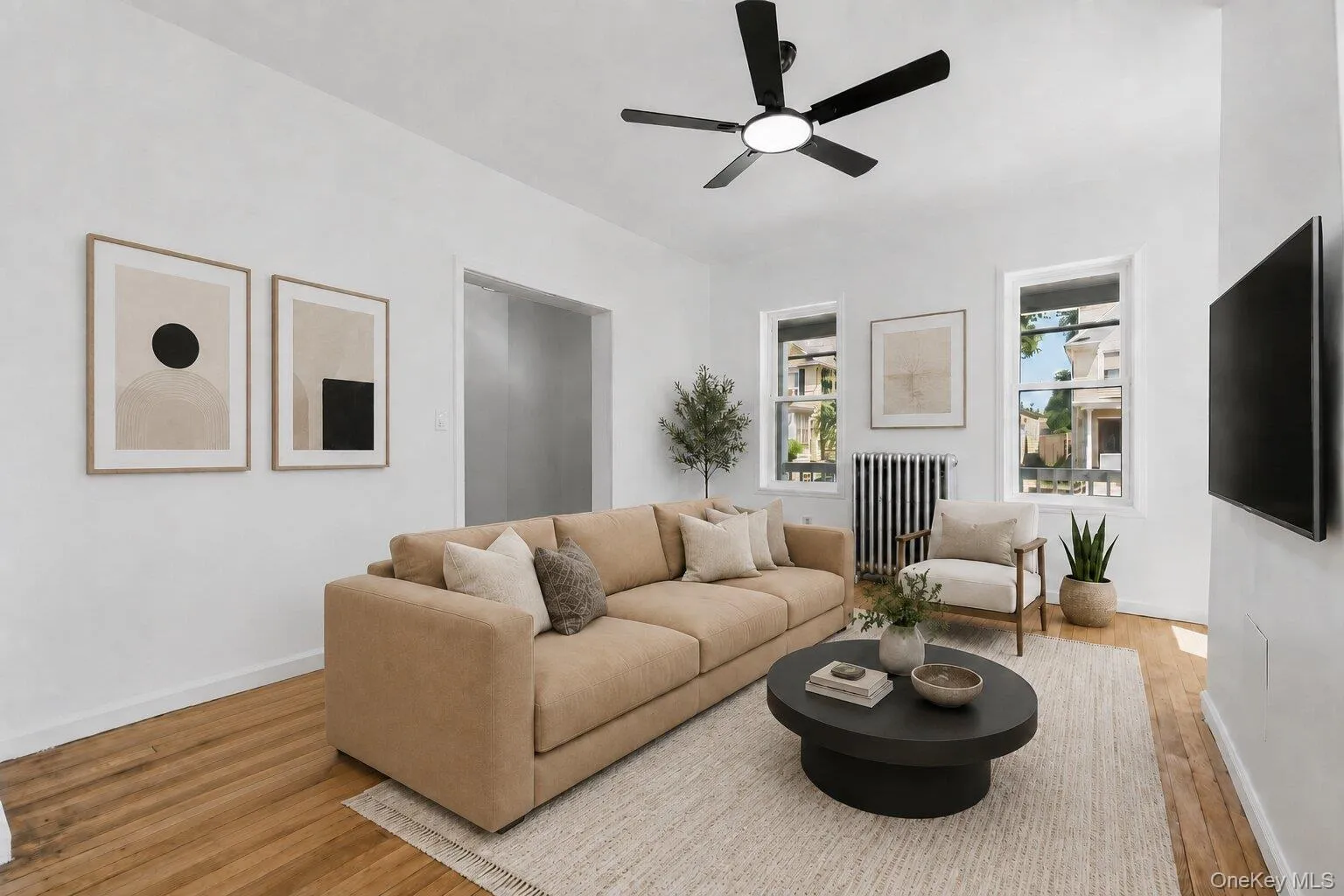 Virtually Staged Bright andspacious living room featuringhardwood floors, oversizedwindows, and abundantnatural light. Virtually Staged Bright andspacious living room featuringhardwood floors, oversizedwindows, and abundantnatural light.