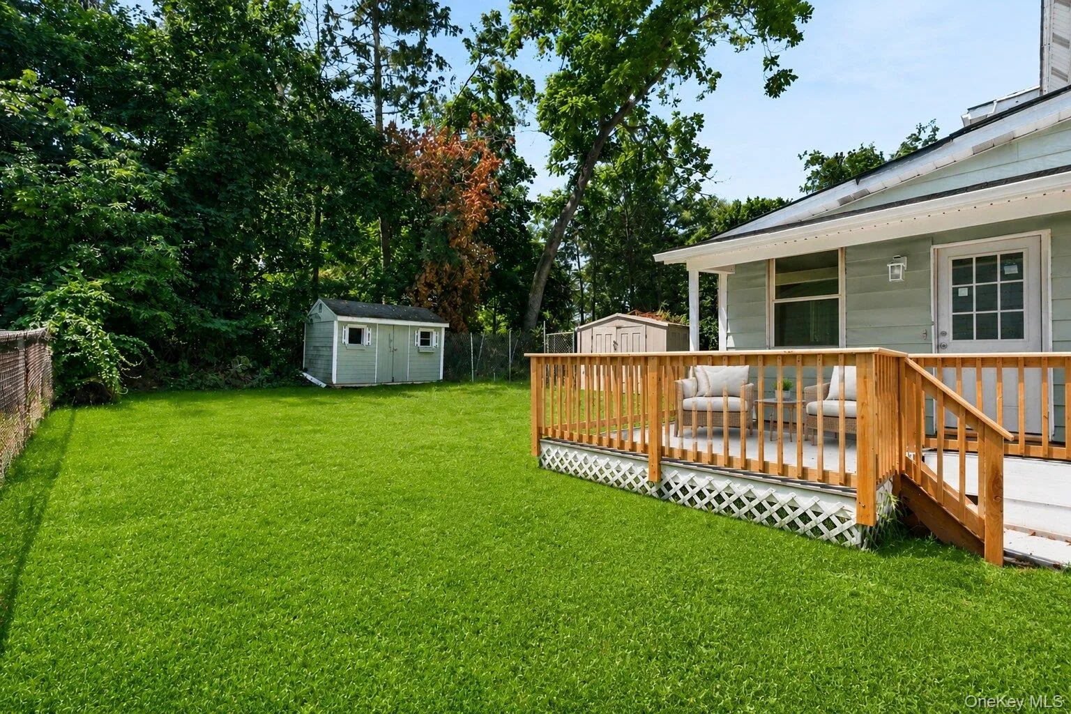 Enjoy a spacious, levelbackyard with lush greenspace, mature trees, storagesheds, and a deck—ideal foroutdoor relaxation andentertaining. Enjoy a spacious, levelbackyard with lush greenspace, mature trees, storagesheds, and a deck—ideal foroutdoor relaxation andentertaining.