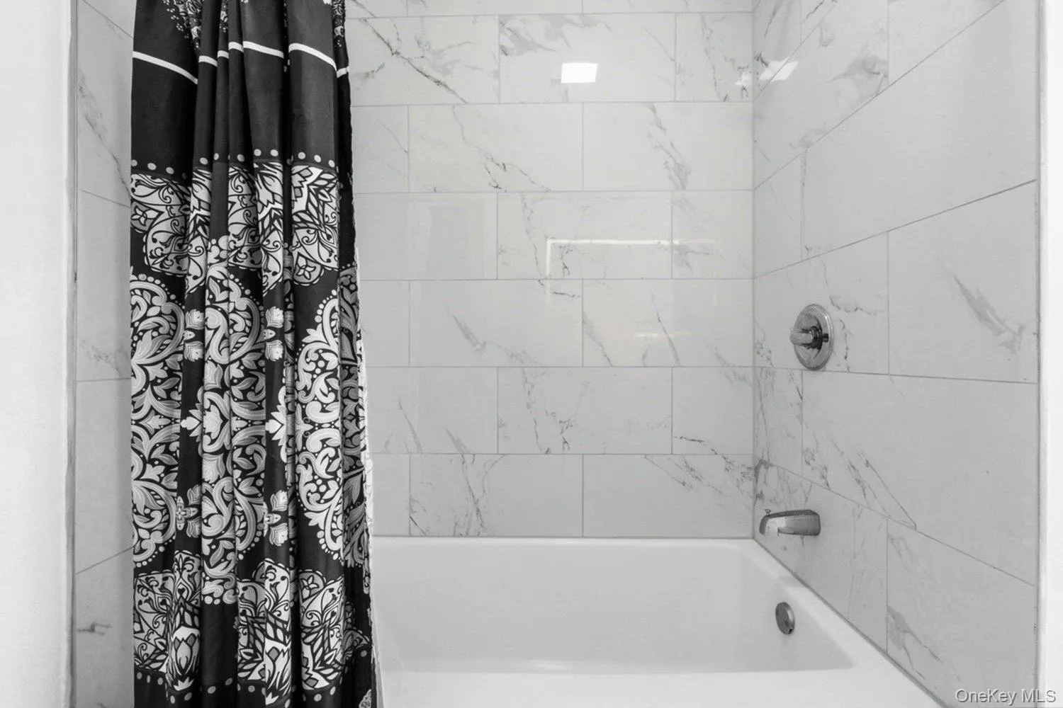 a beautiful tub/shower combowith elegant tile work a beautiful tub/shower combowith elegant tile work