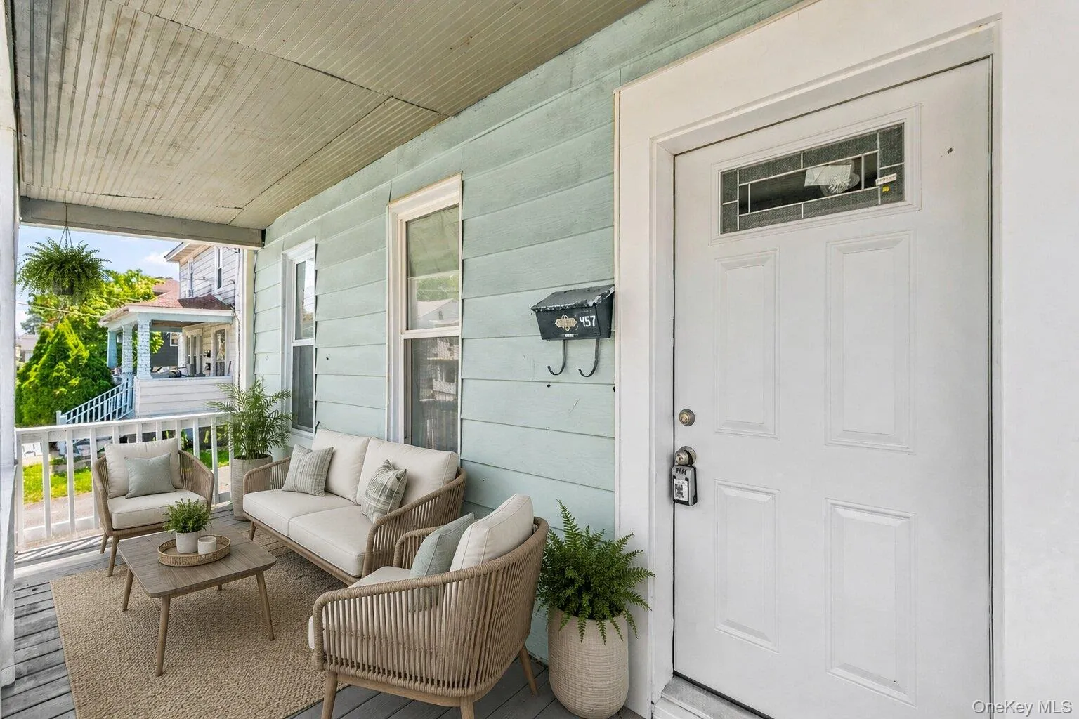Virtually Staged Classic frontporch with seating area Virtually Staged Classic frontporch with seating area