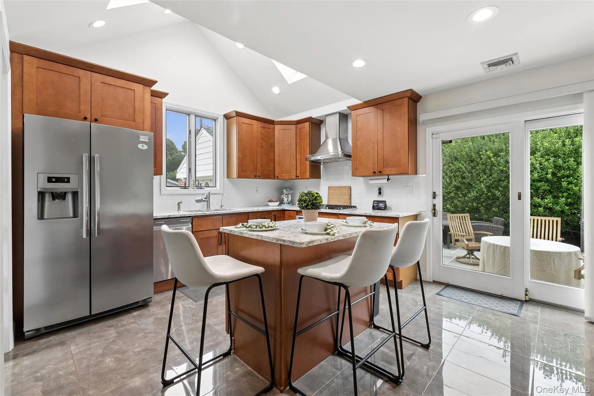 Fabulous eat-in-kitchen with vaulted, skylit ceiling and sliders to the patio Fabulous eat-in-kitchen with vaulted, skylit ceiling and sliders to the patio