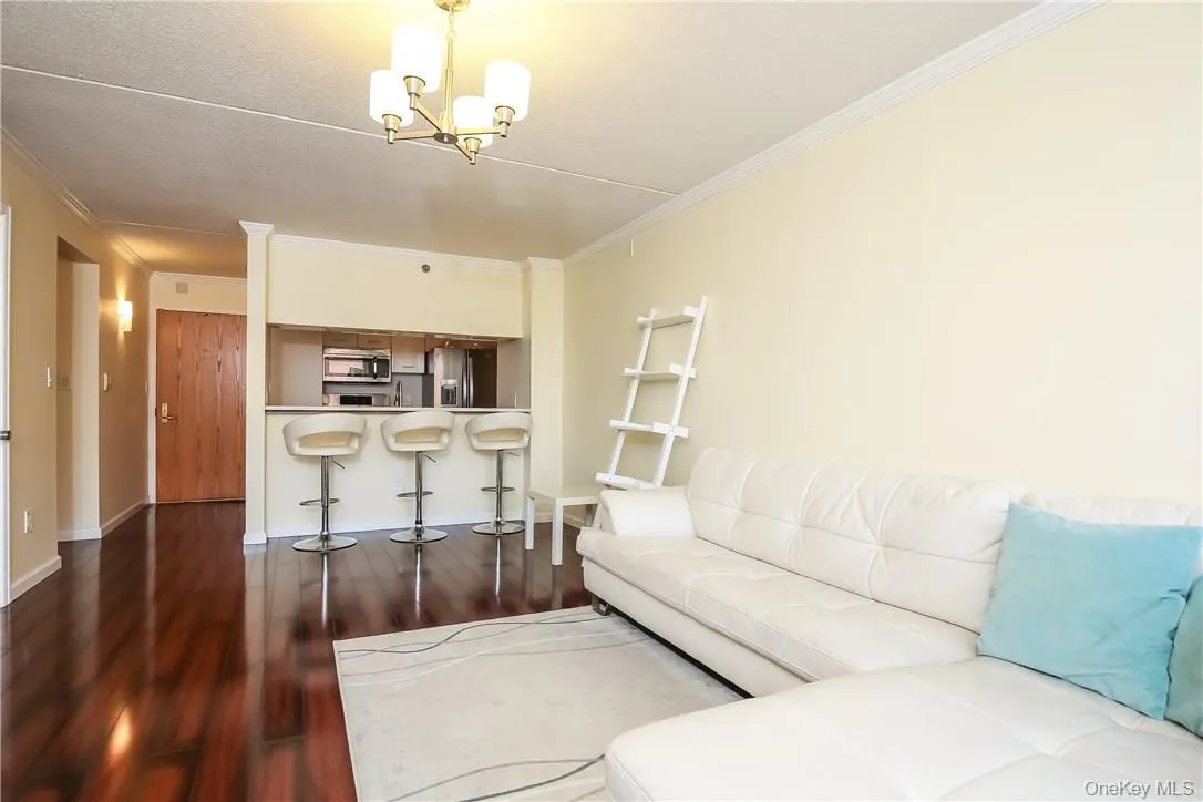 Living room/dining area with a view of kitchen Living room/dining area with a view of kitchen