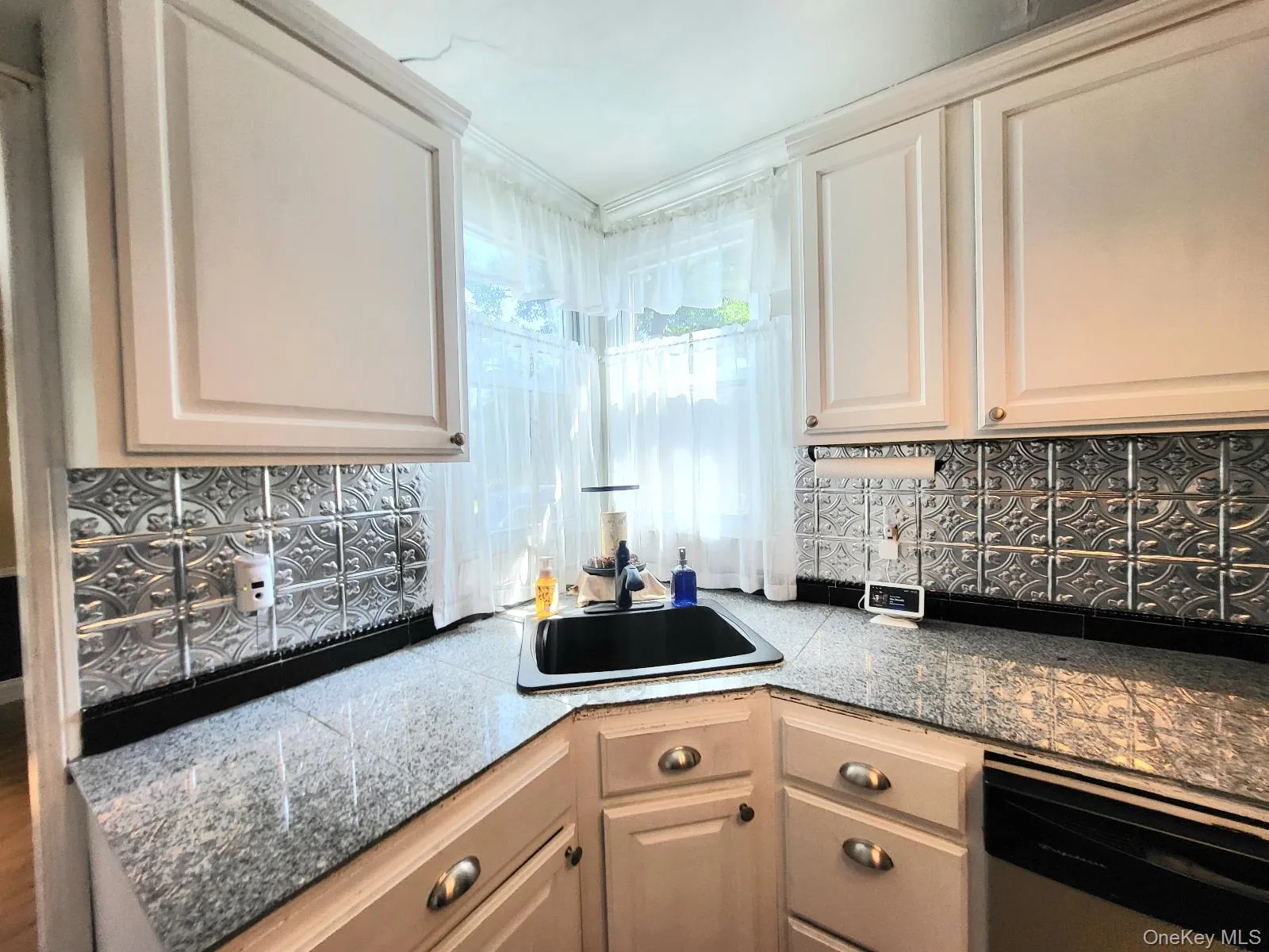 Corner window adds charm to kitchen! Corner window adds charm to kitchen!