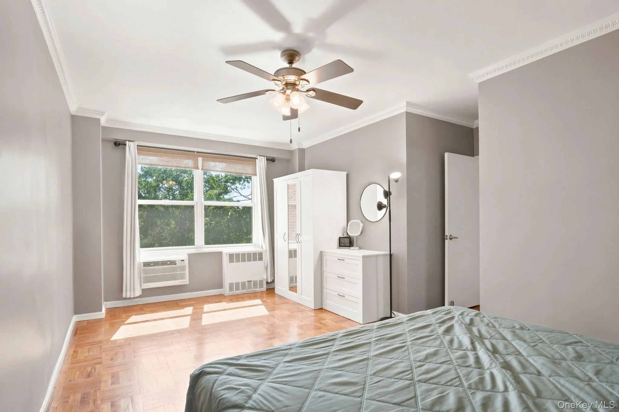 another view of the main bedroom with large windows and ample sunlight another view of the main bedroom with large windows and ample sunlight