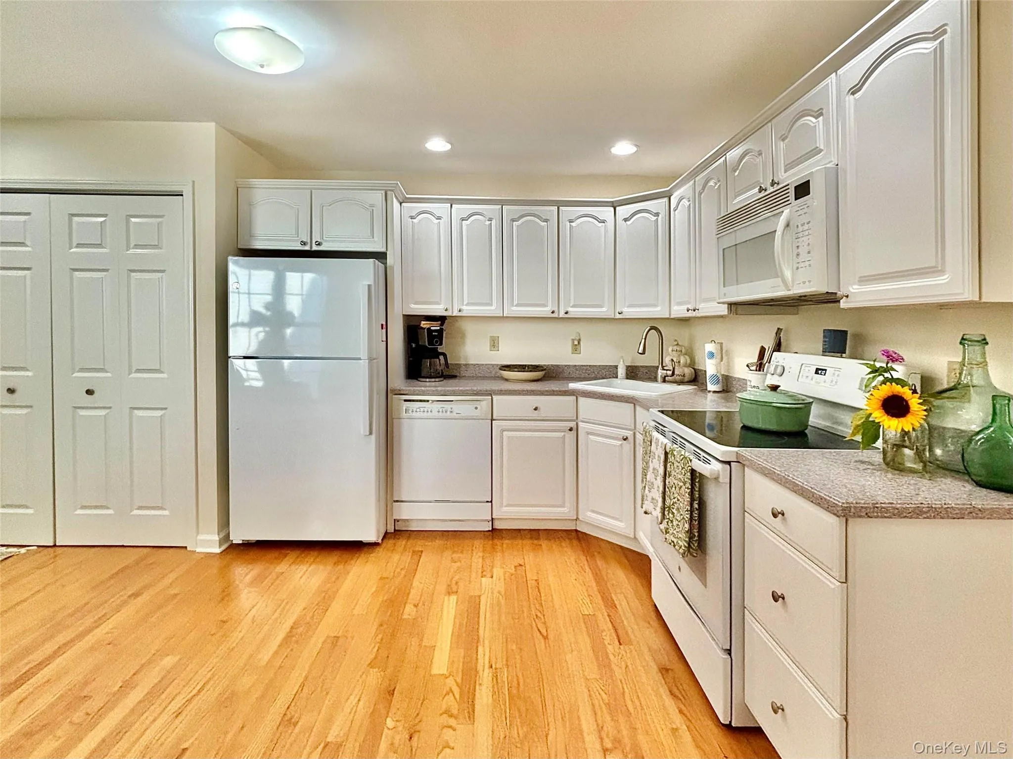 Kitchen with laundry area Kitchen with laundry area