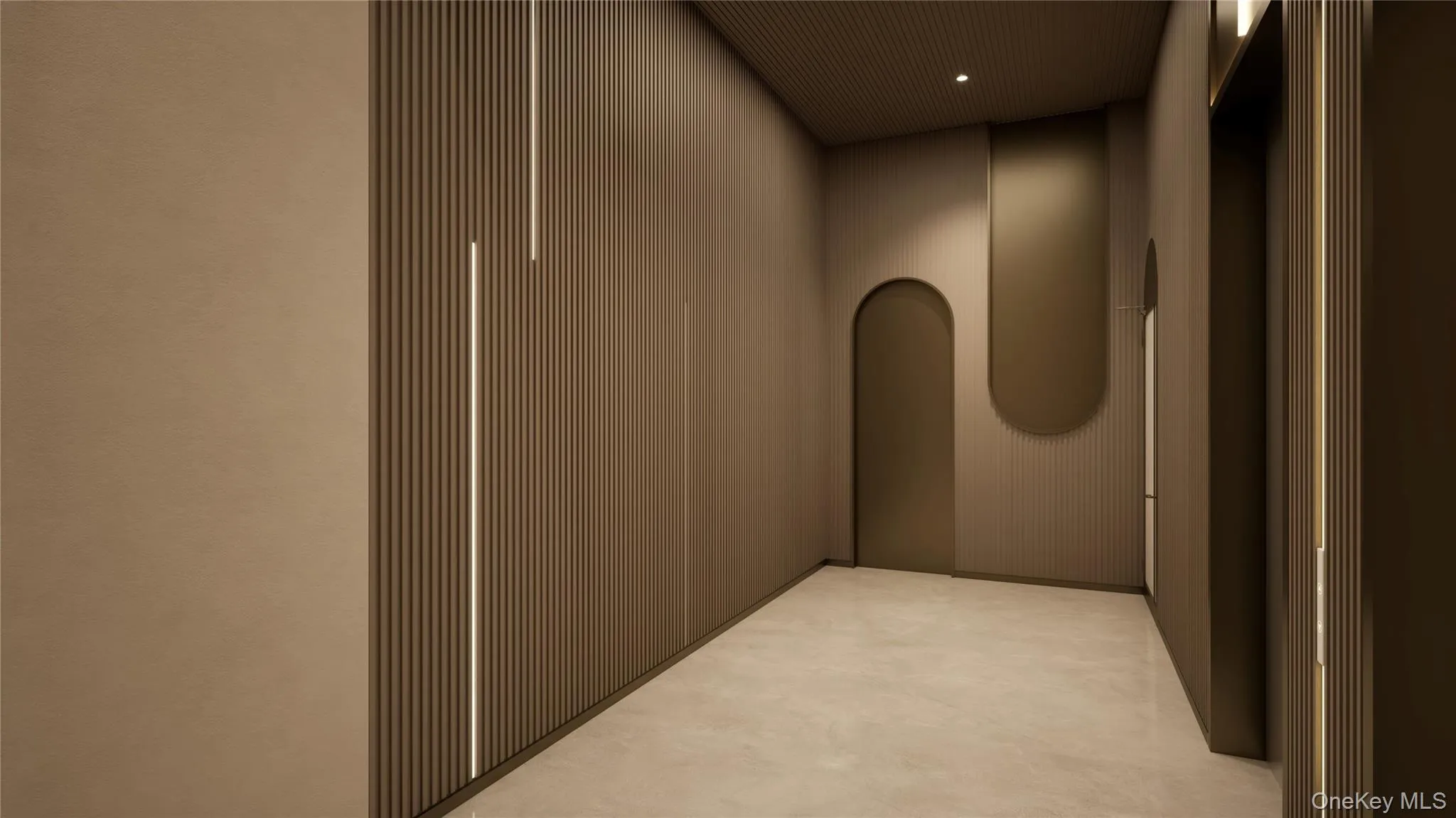 Corridor with elevator, arched walkways, and recessed lighting Corridor with elevator, arched walkways, and recessed lighting