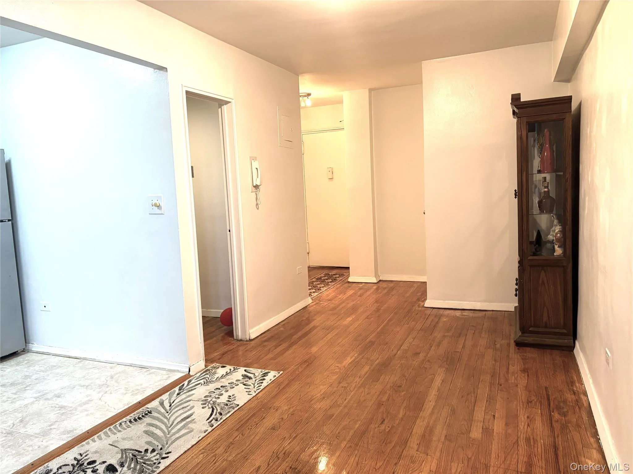 Spare room featuring baseboards and wood finished floors Spare room featuring baseboards and wood finished floors