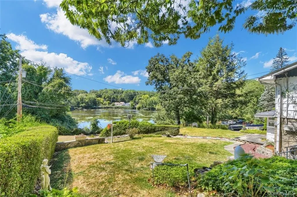 View of yard with a water view View of yard with a water view