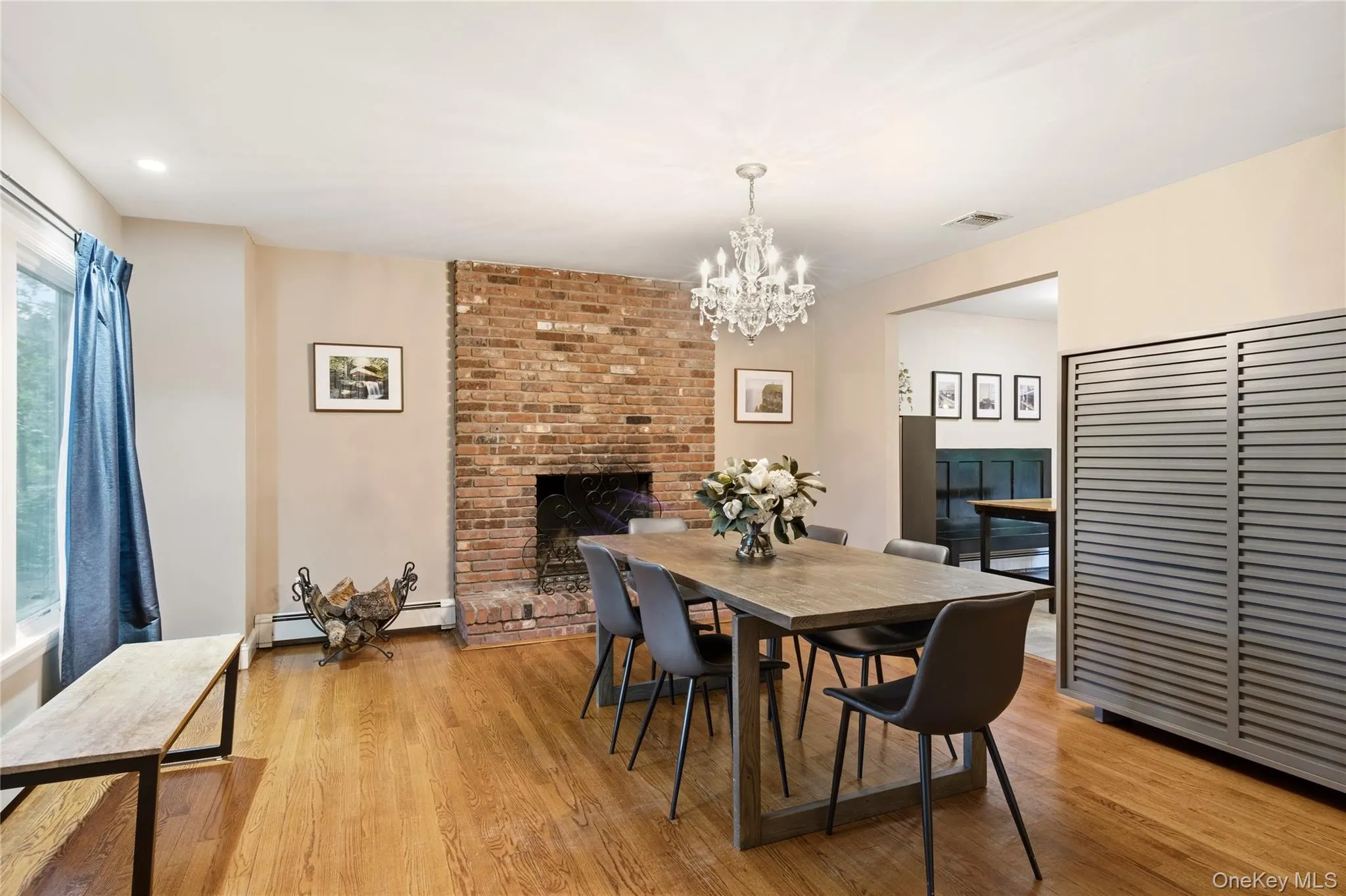 Dining Room w/ Wood Burning Fireplace & Exposed Wood Floors Dining Room w/ Wood Burning Fireplace & Exposed Wood Floors