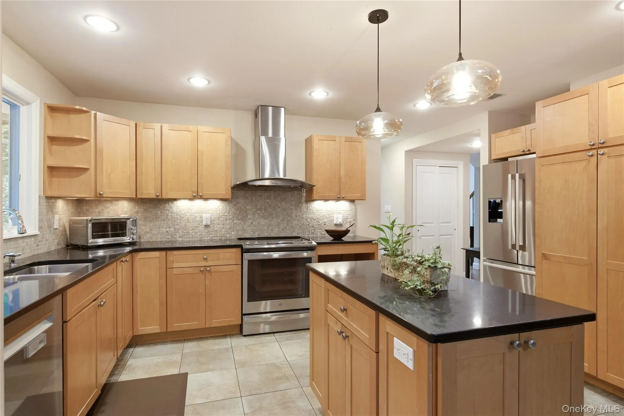 Stainless Steel Appliances, Silestone Counters, Pendant Lighting Over Island Stainless Steel Appliances, Silestone Counters, Pendant Lighting Over Island