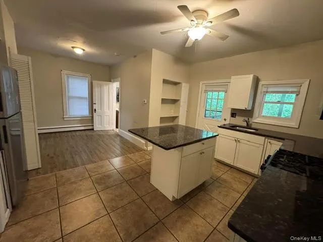 View of the kitchen and the dining area. View of the kitchen and the dining area.