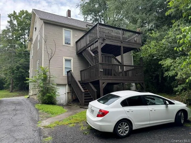 View of the back of the house and the deck. View of the back of the house and the deck.