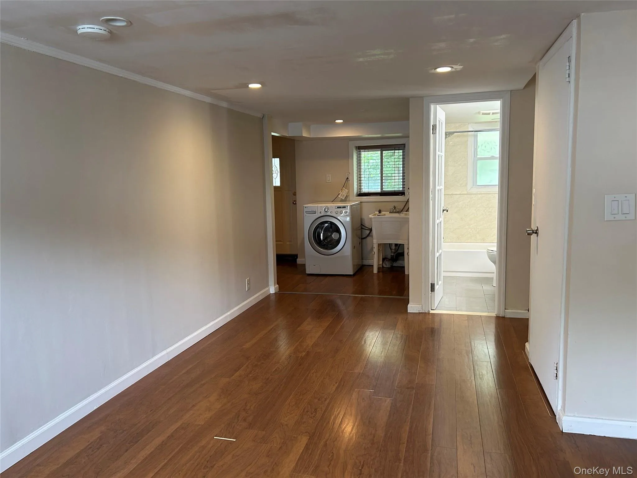 Lower Level with Laundry, Mudroom, and Access to Garage Lower Level with Laundry, Mudroom, and Access to Garage