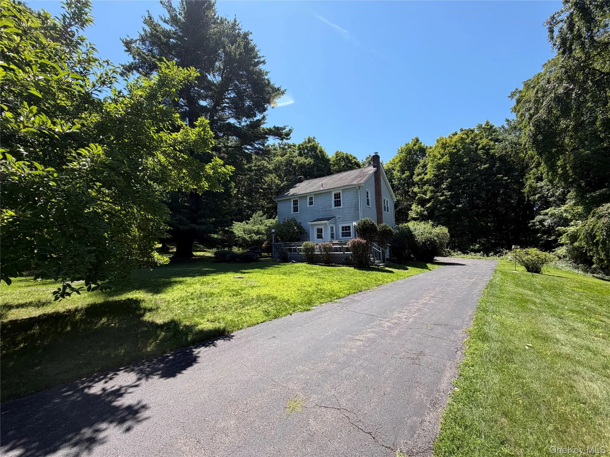 Wrap around driveway leading to 2 car garage Wrap around driveway leading to 2 car garage