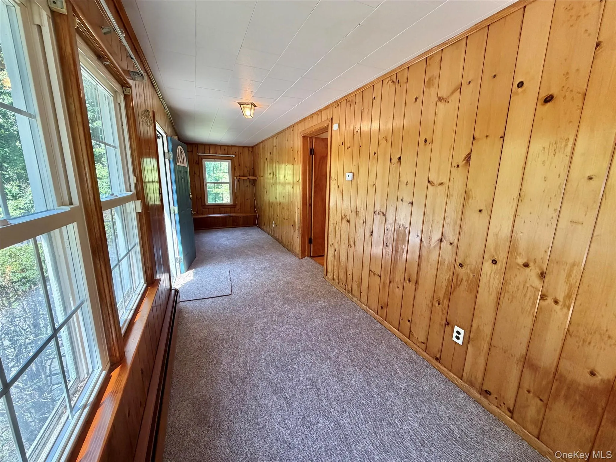 Enclosed front porch with built in storage benches Enclosed front porch with built in storage benches