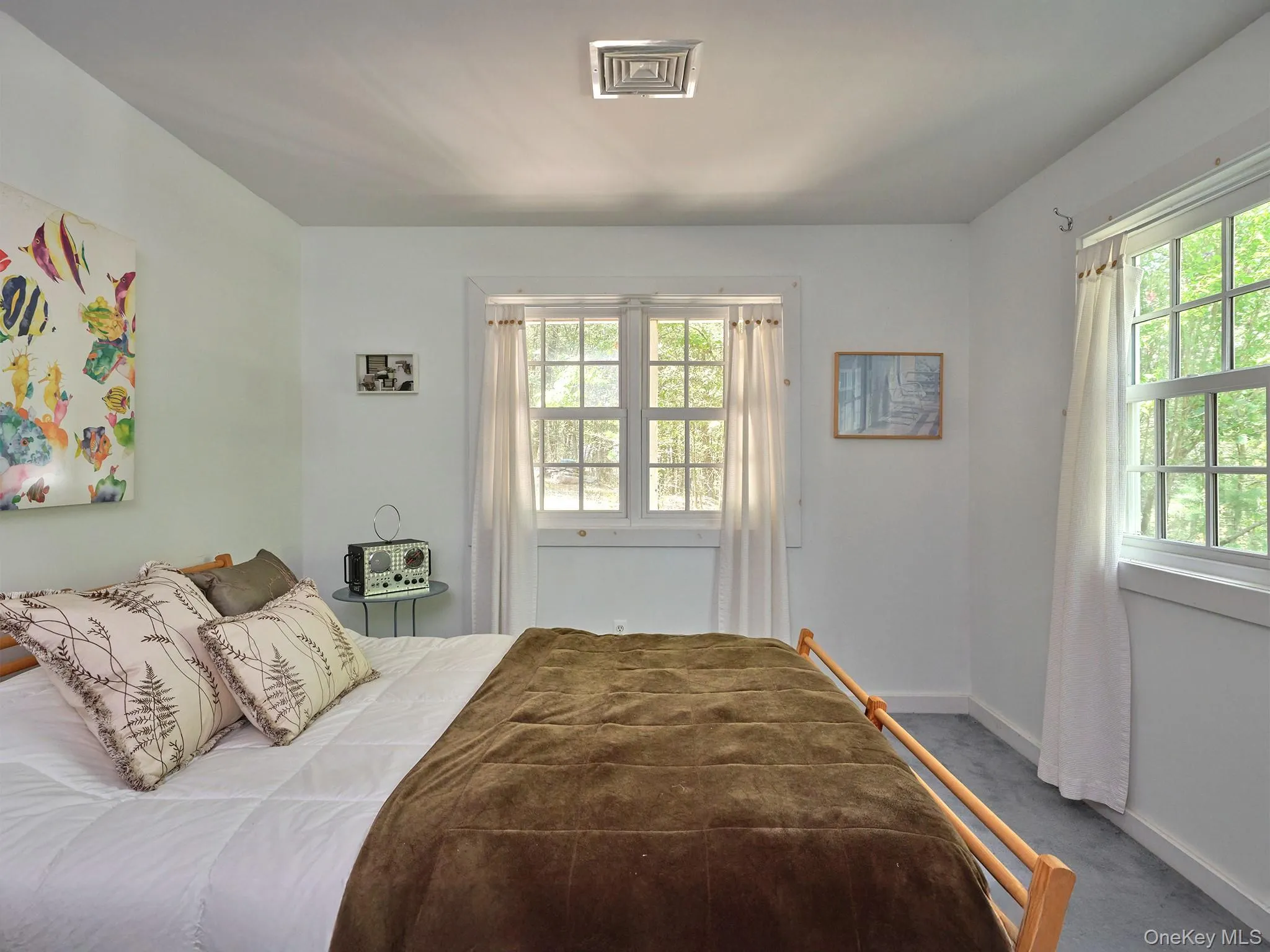 Bedroom featuring carpet floors and baseboards Bedroom featuring carpet floors and baseboards