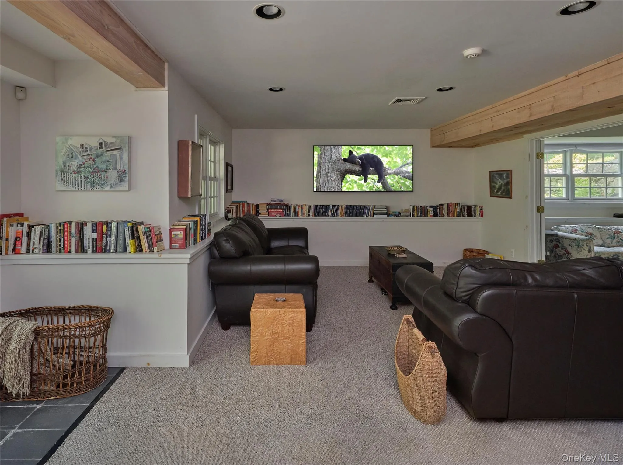 Living area with carpet flooring, beamed ceiling, and recessed lighting Living area with carpet flooring, beamed ceiling, and recessed lighting