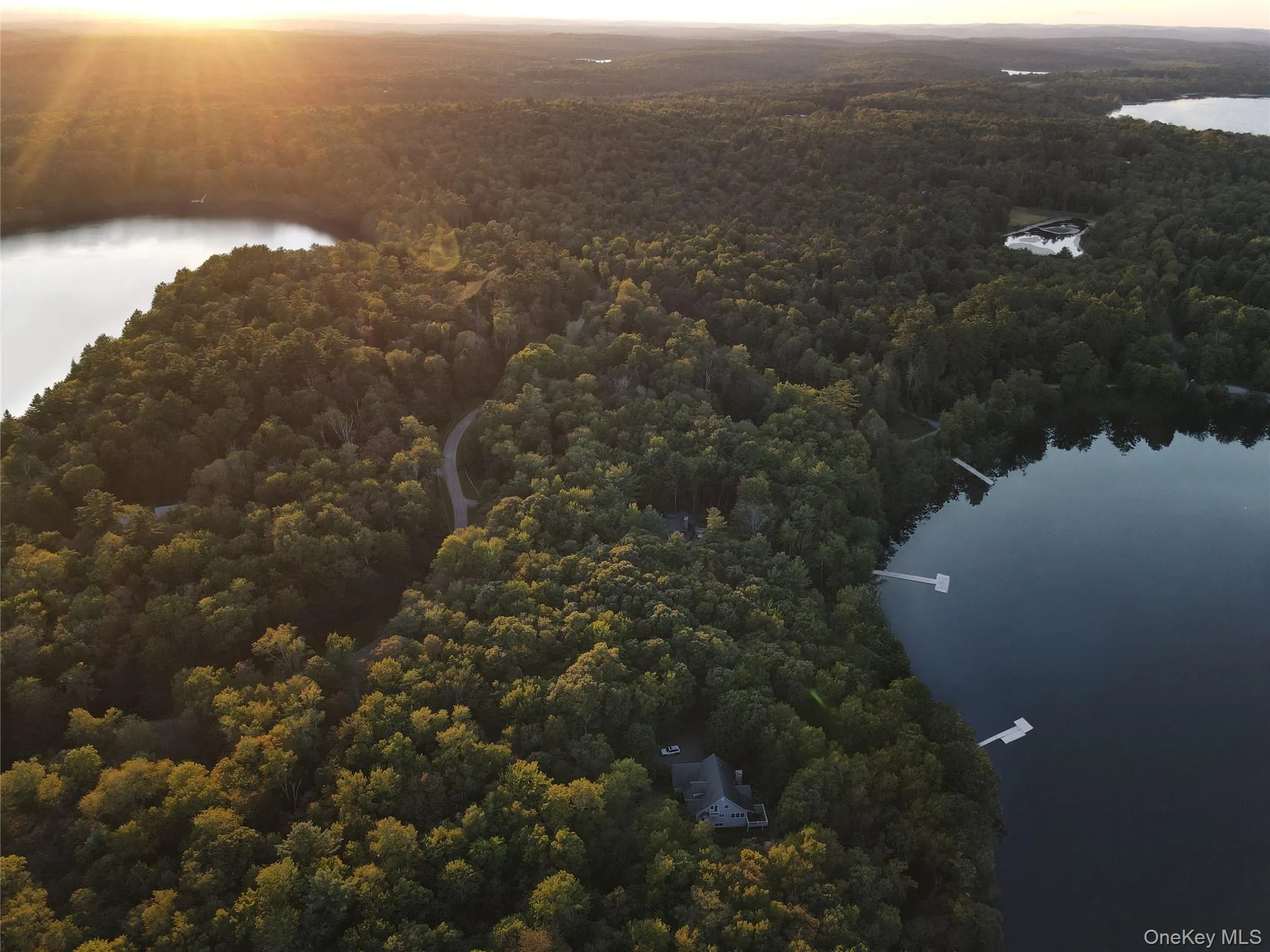 Aerial view at dusk of a water view and a view of trees Aerial view at dusk of a water view and a view of trees