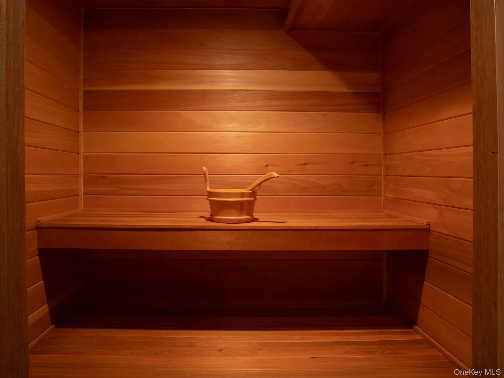 Relaxing sauna / steam room featuring wooden walls Relaxing sauna / steam room featuring wooden walls
