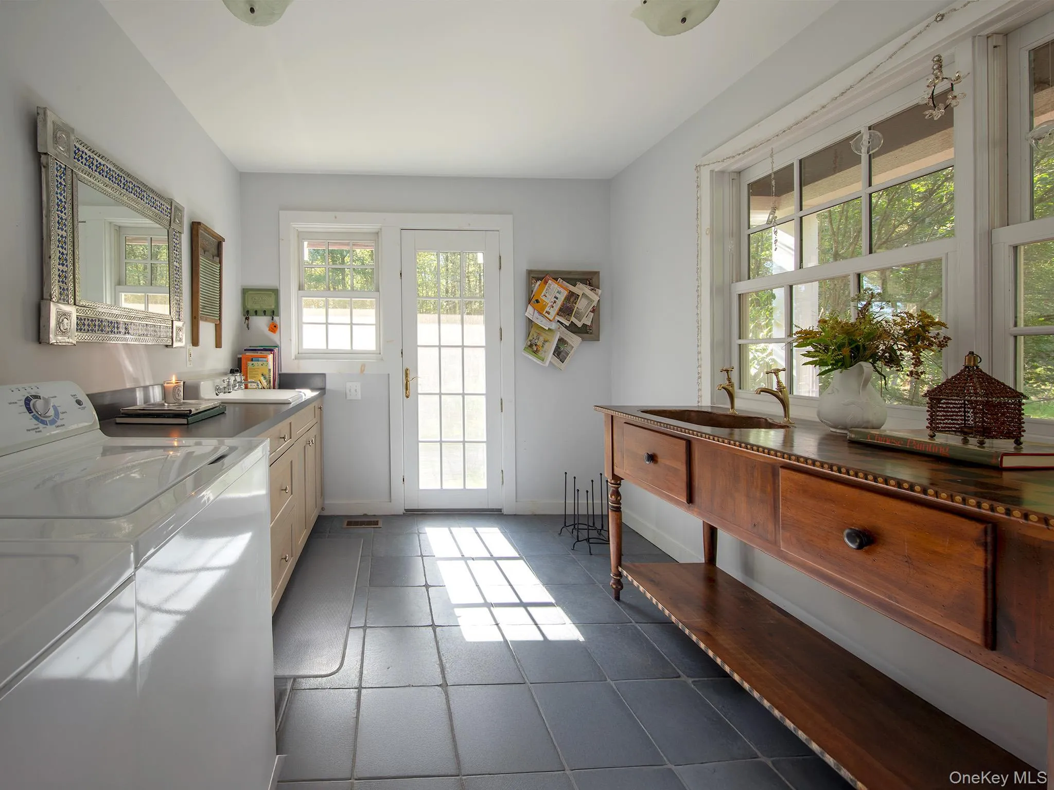 Entryway featuring tile patterned flooring and washing machine and dryer Entryway featuring tile patterned flooring and washing machine and dryer