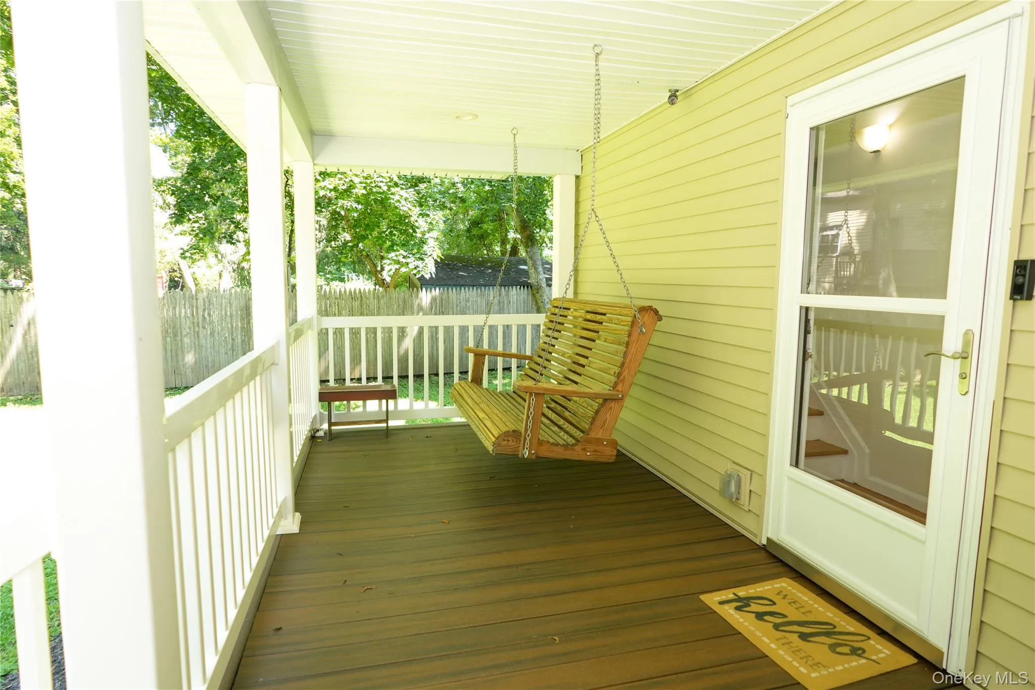 Front porch with custom swing to enjoy any time of the day or evening. Front porch with custom swing to enjoy any time of the day or evening.