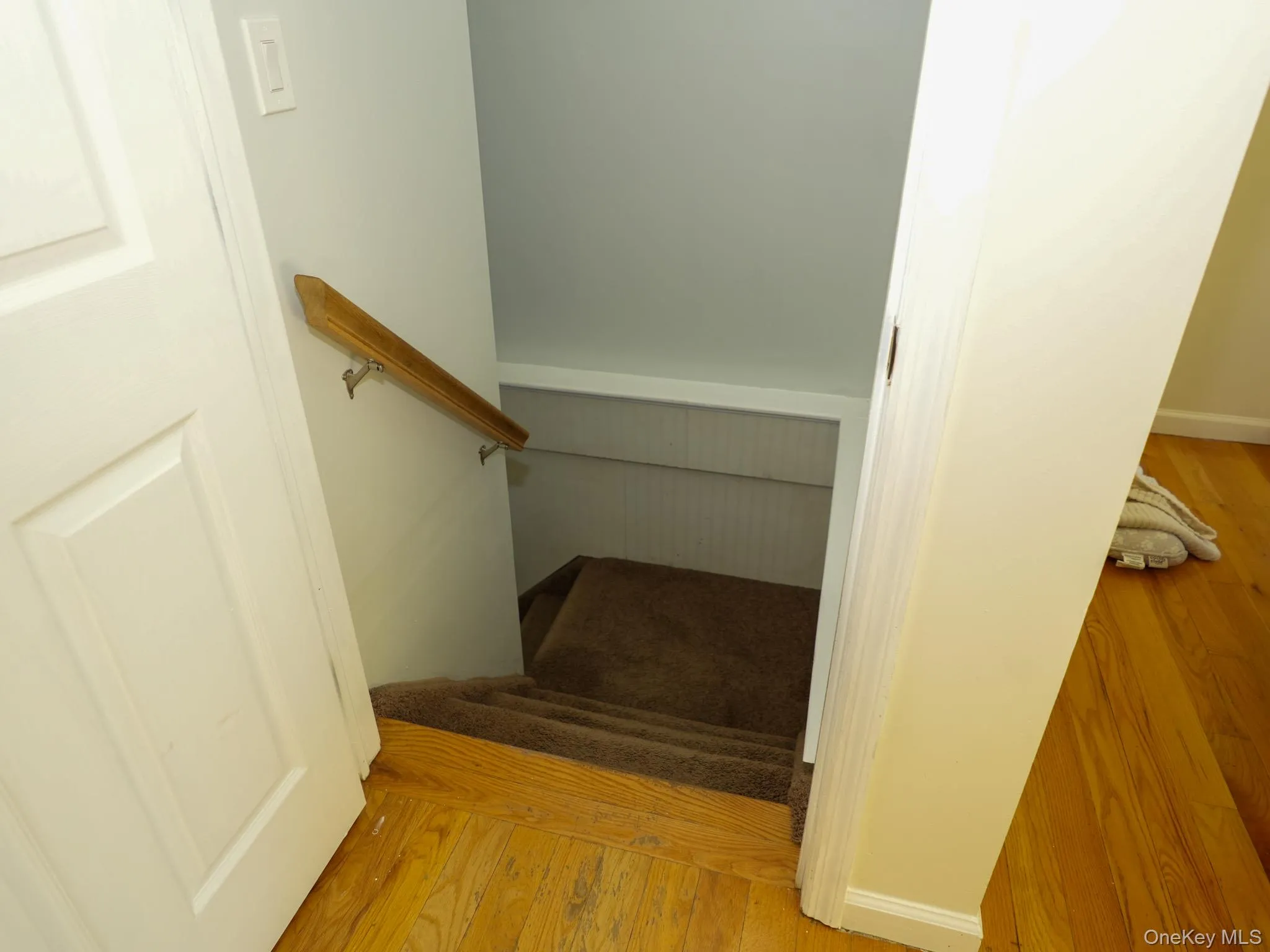 Stairs off of entryway leading to basement Stairs off of entryway leading to basement