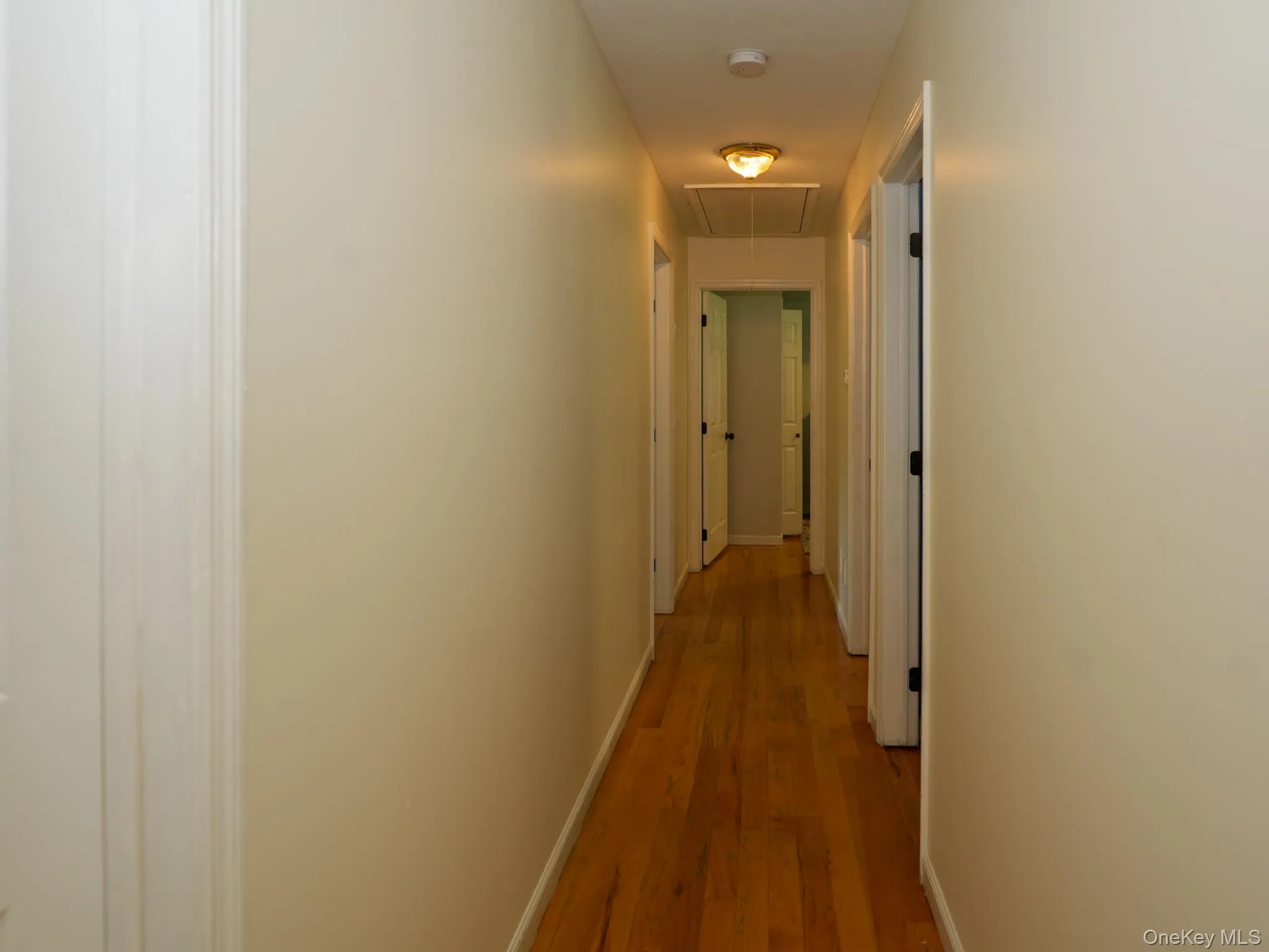 Upstairs hallway leading to full bathroom and four bedrooms Upstairs hallway leading to full bathroom and four bedrooms