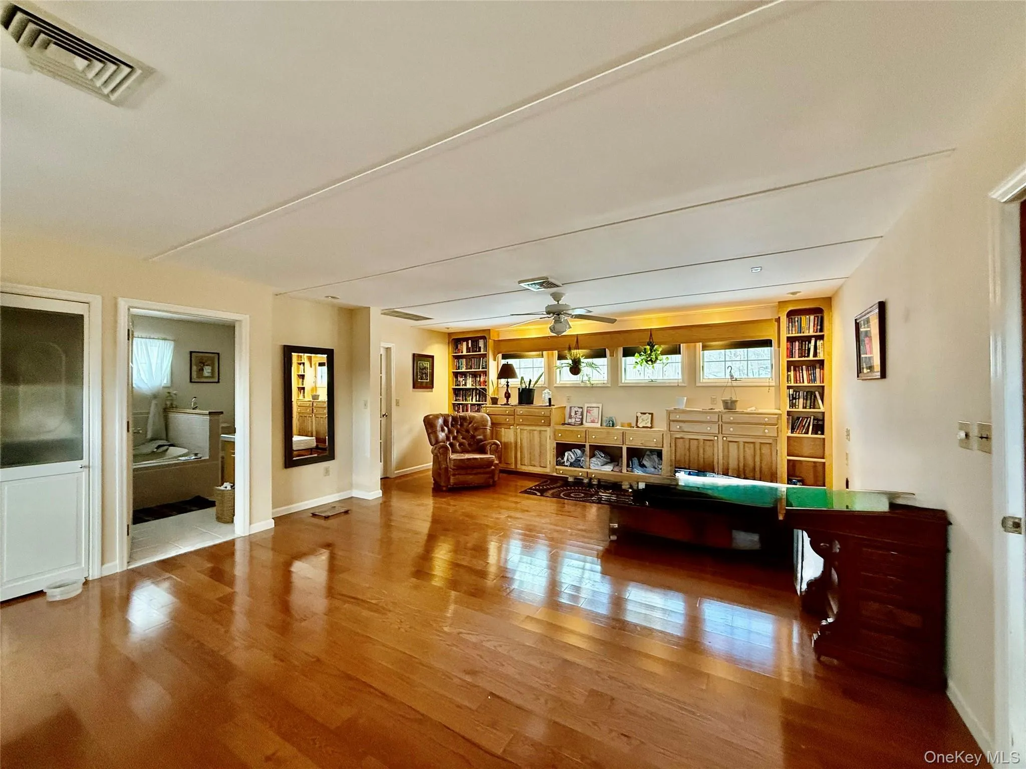 Recreation room with ceiling fan and wood finished floors Recreation room with ceiling fan and wood finished floors