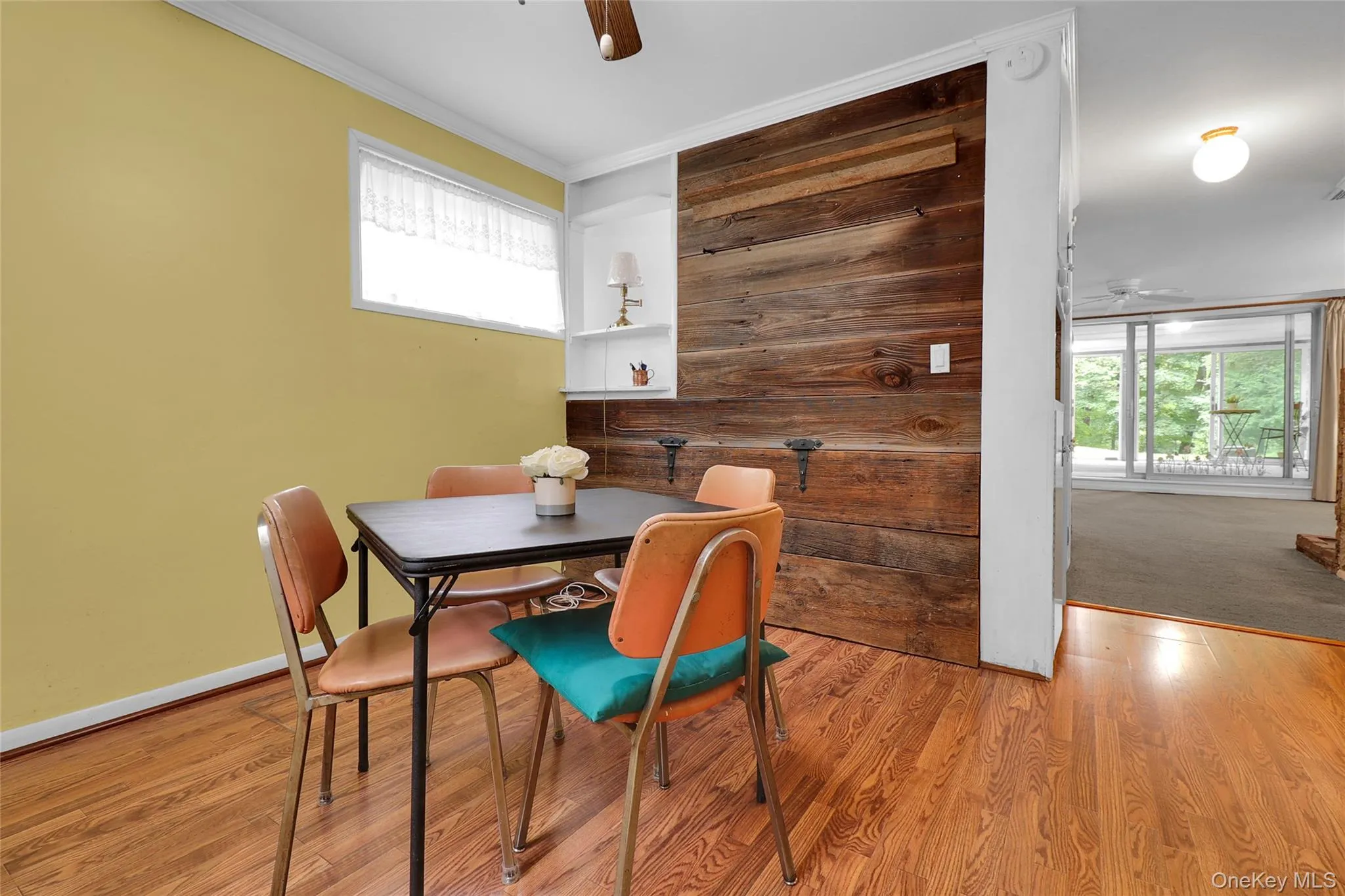 Open dining area with wood panelling Open dining area with wood panelling