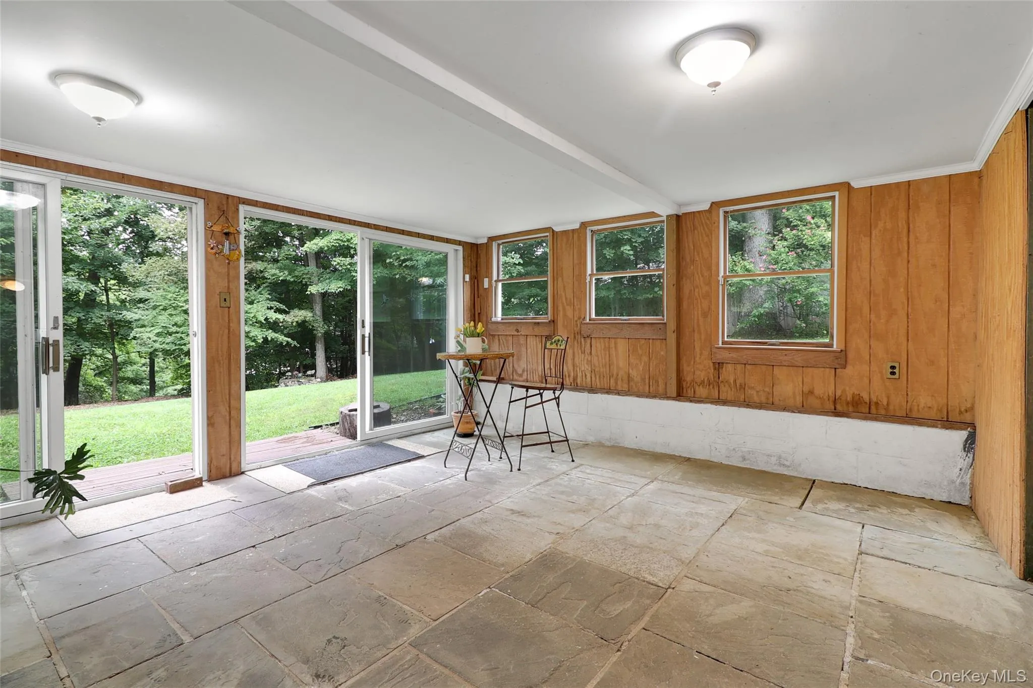 Large 3 season room off living room leading to back yard Large 3 season room off living room leading to back yard