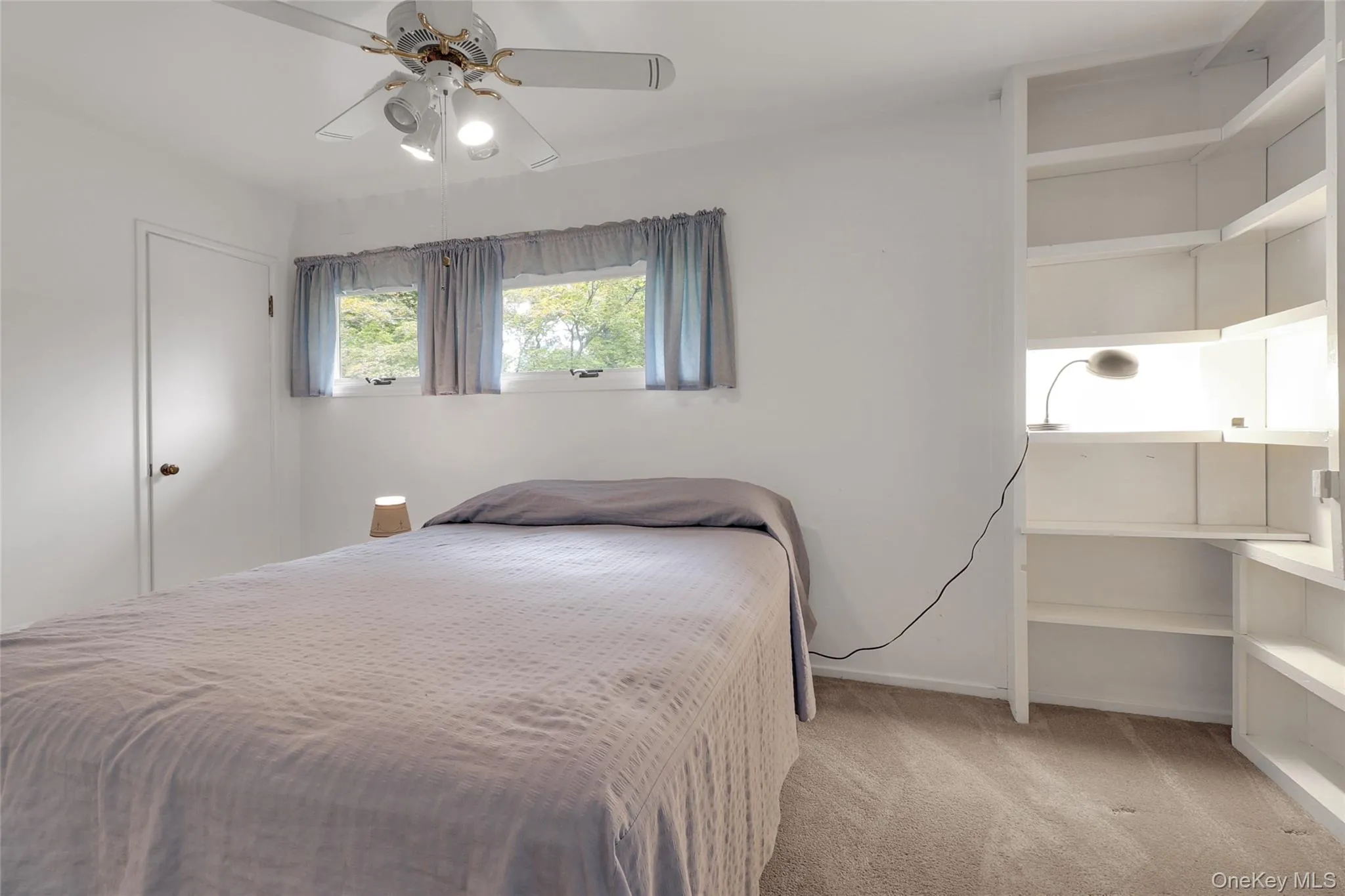 Primary bedroom with closet and built in units Primary bedroom with closet and built in units