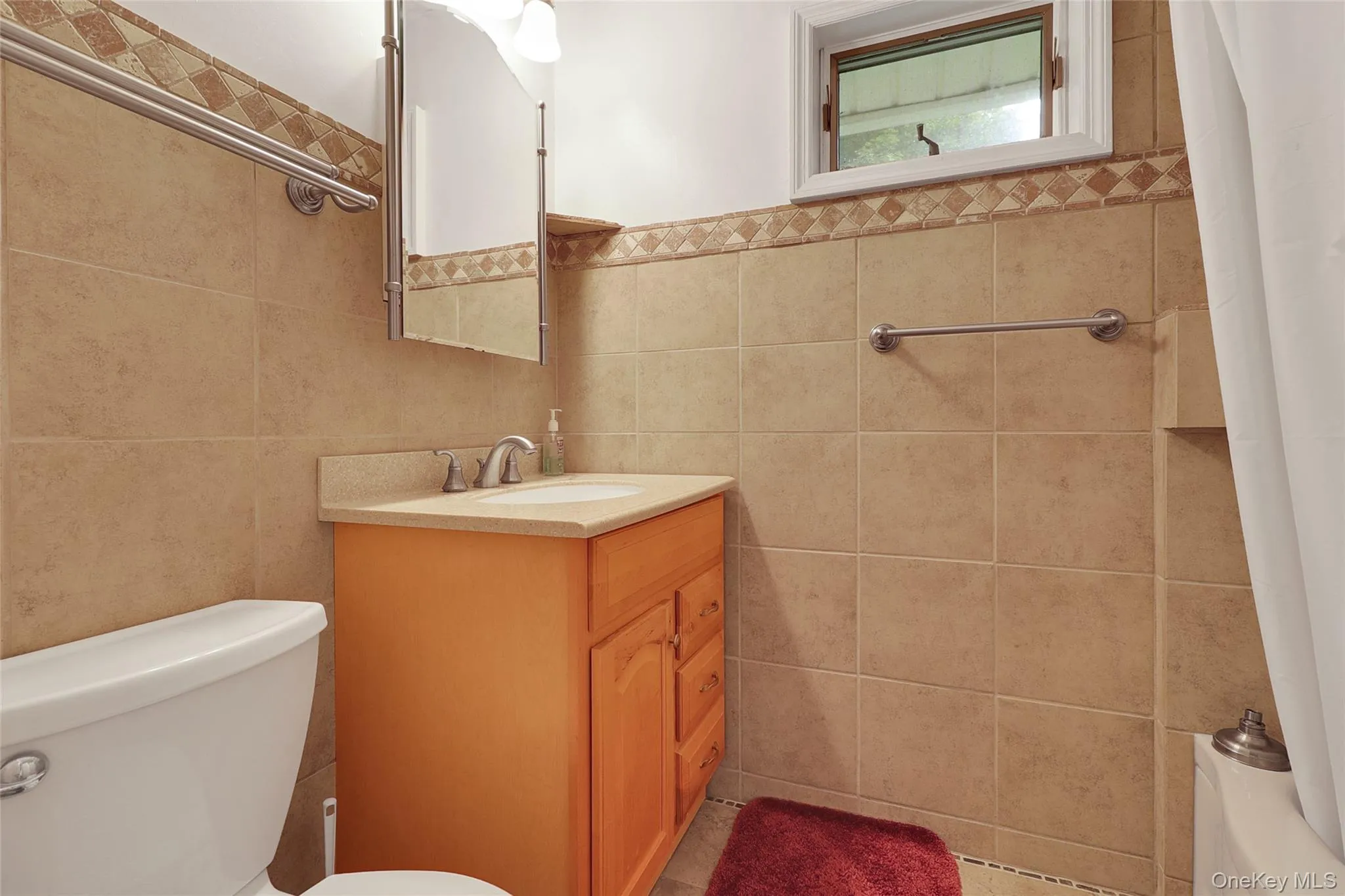 Main bathroom with full bath and window Main bathroom with full bath and window