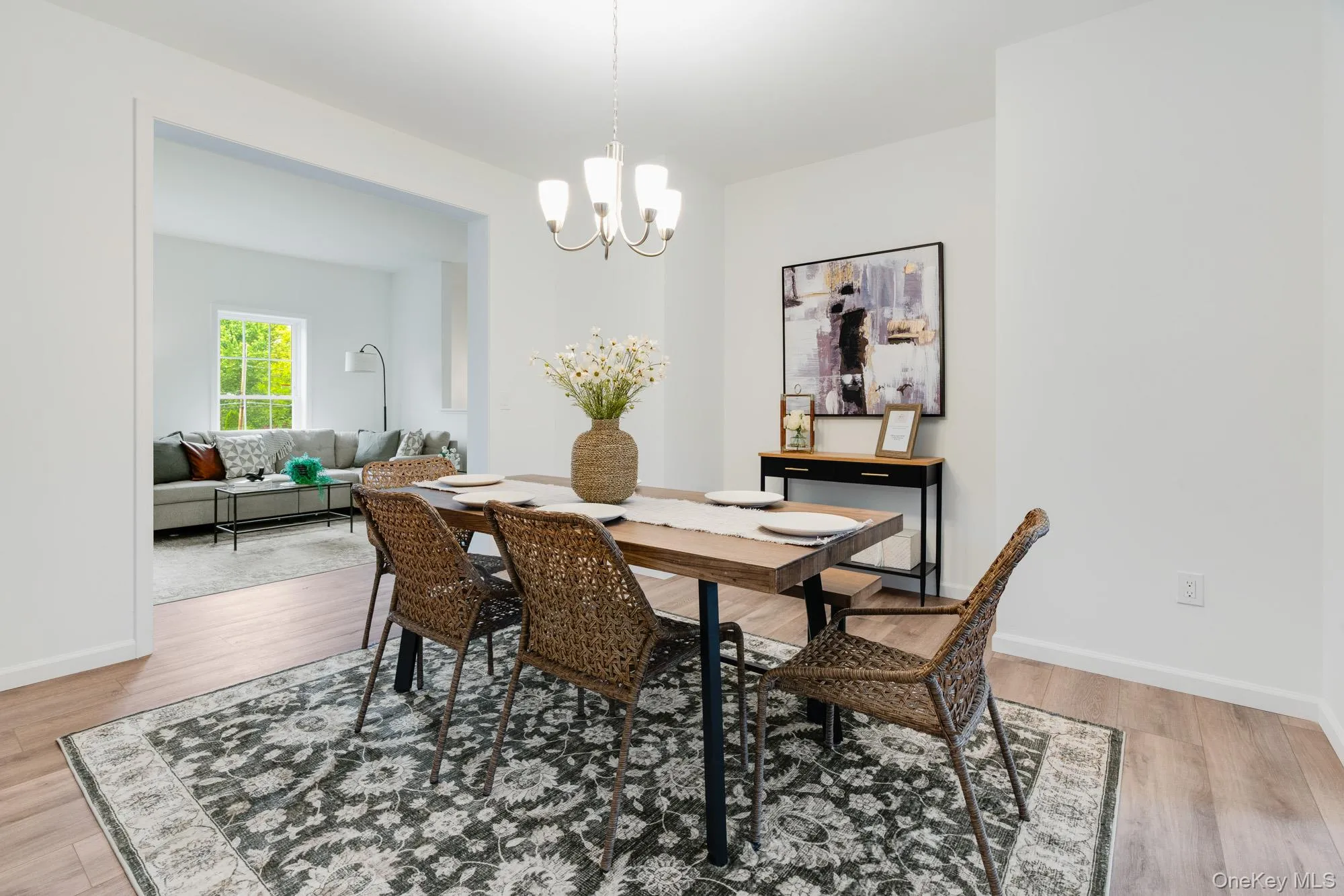 Dining area featuring a chandelier, wood finished floors Dining area featuring a chandelier, wood finished floors