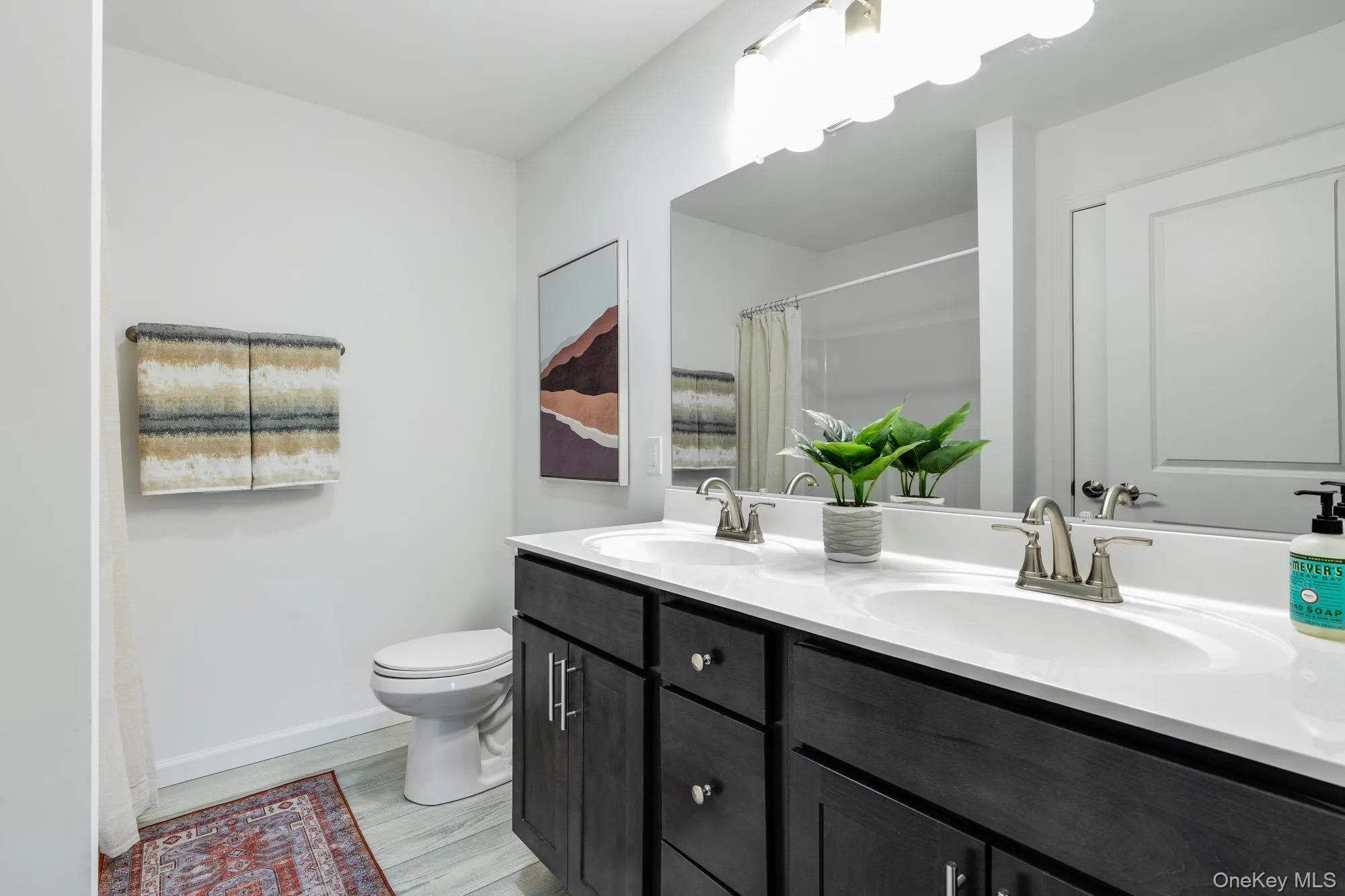 Primary bath, double vanities, walk in shower and linen closet Primary bath, double vanities, walk in shower and linen closet