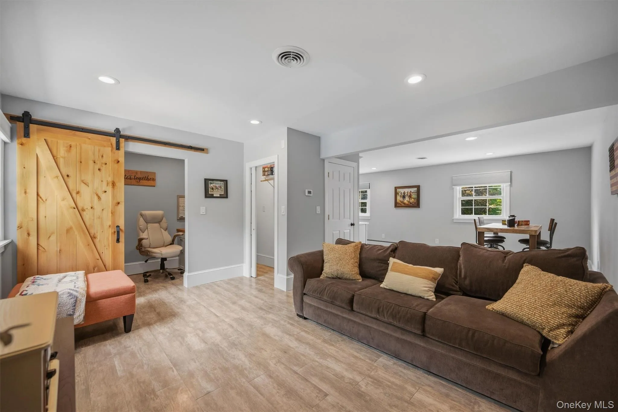 The barn doors unfold a home office space. The barn doors unfold a home office space.