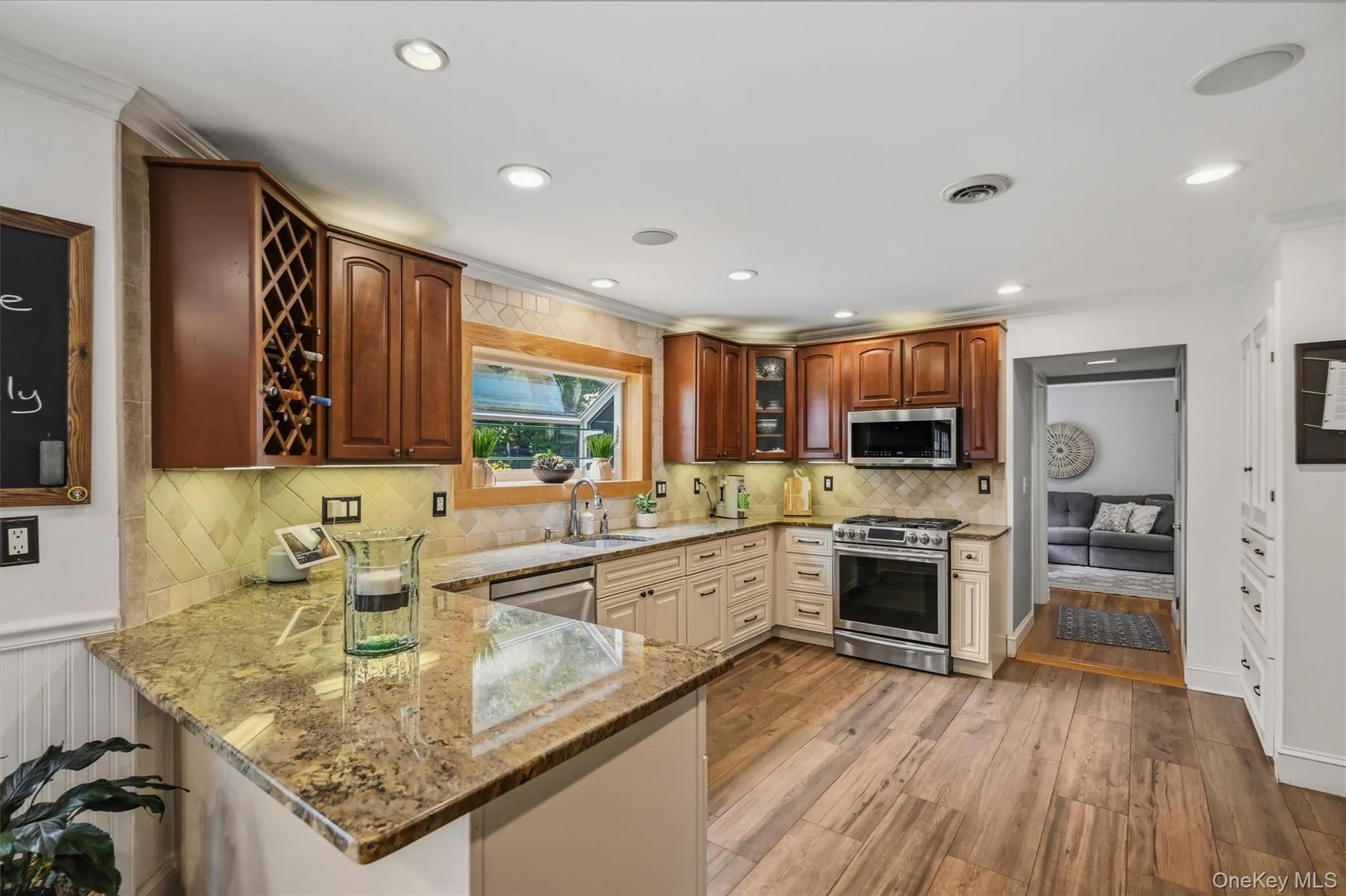 You've got a built in wine rack, granite counters and a custom tiled backsplash. You've got a built in wine rack, granite counters and a custom tiled backsplash.