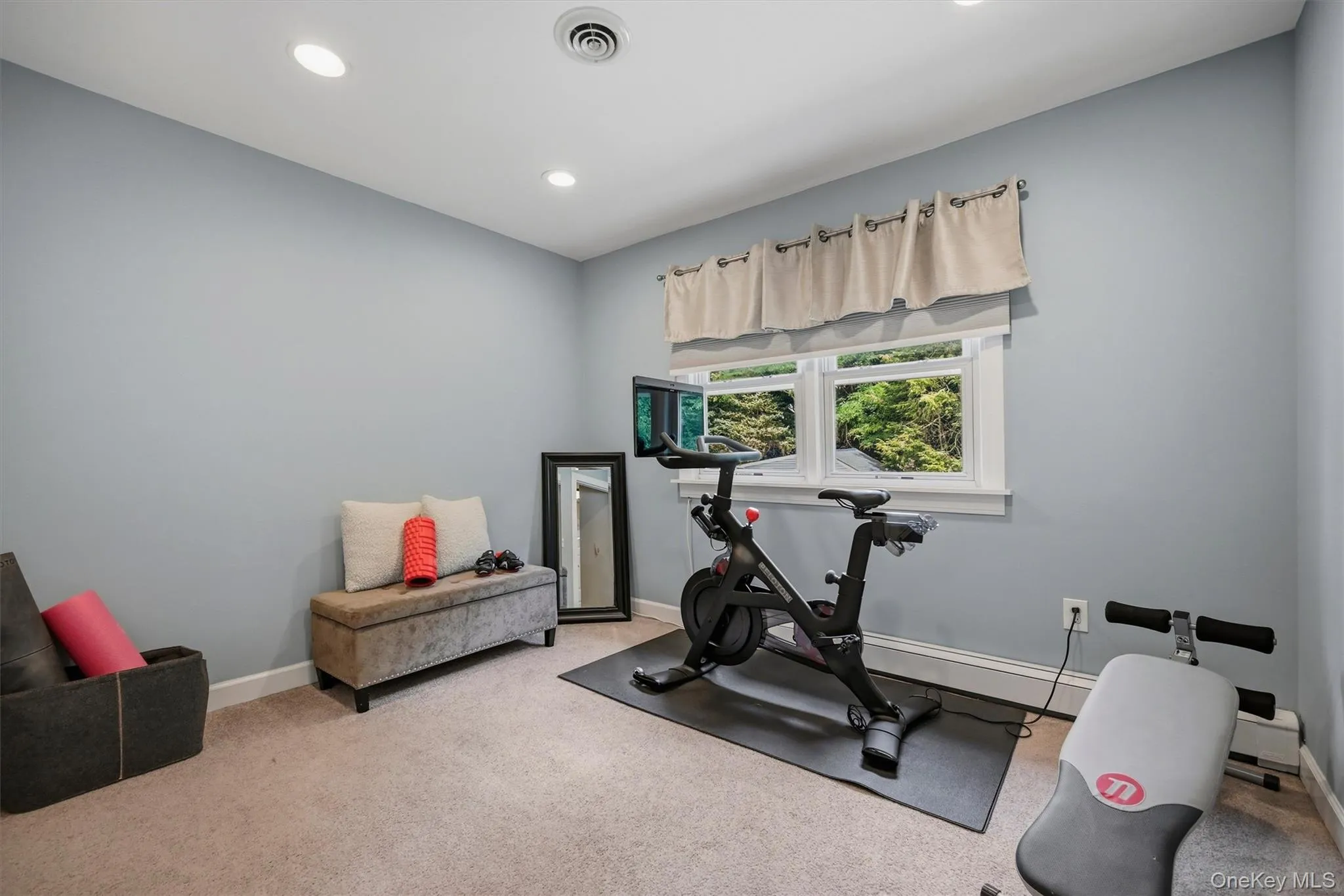 The second bedroom is currently used as a home gym. The second bedroom is currently used as a home gym.