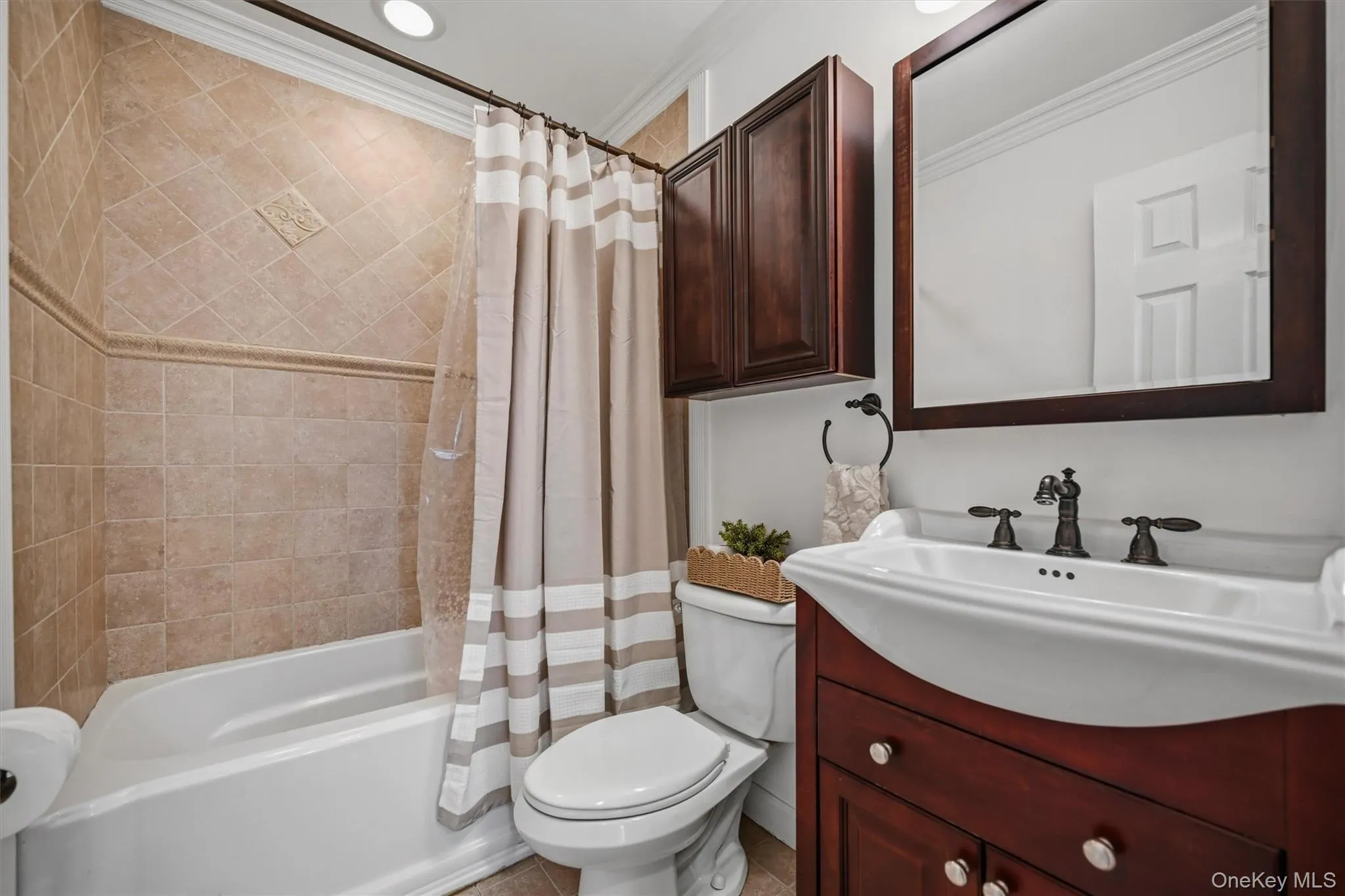 The guest bathroom was freshly painted and offers a tiled shower and tub. The guest bathroom was freshly painted and offers a tiled shower and tub.